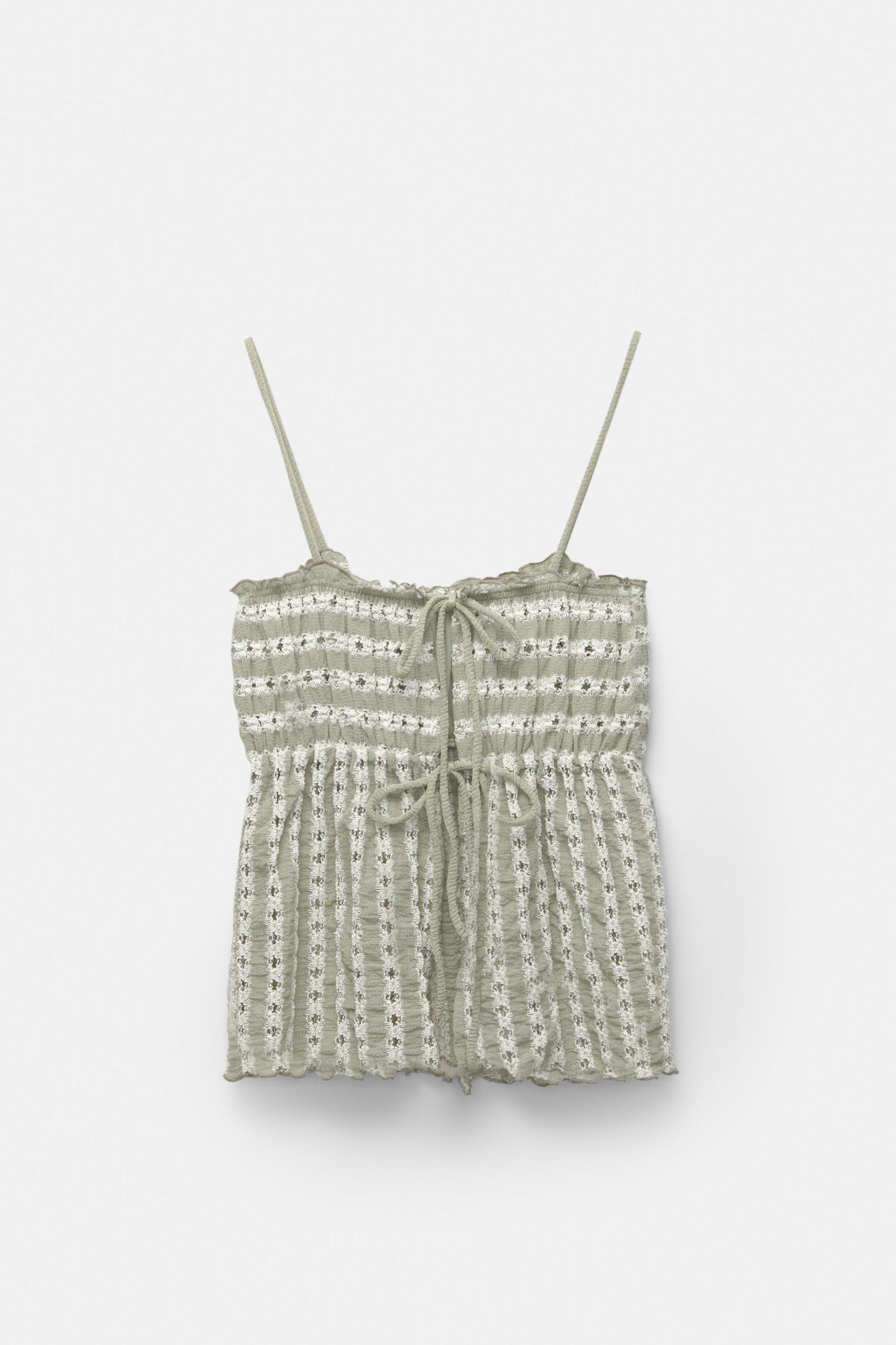 Open-knit top with bows Product Image