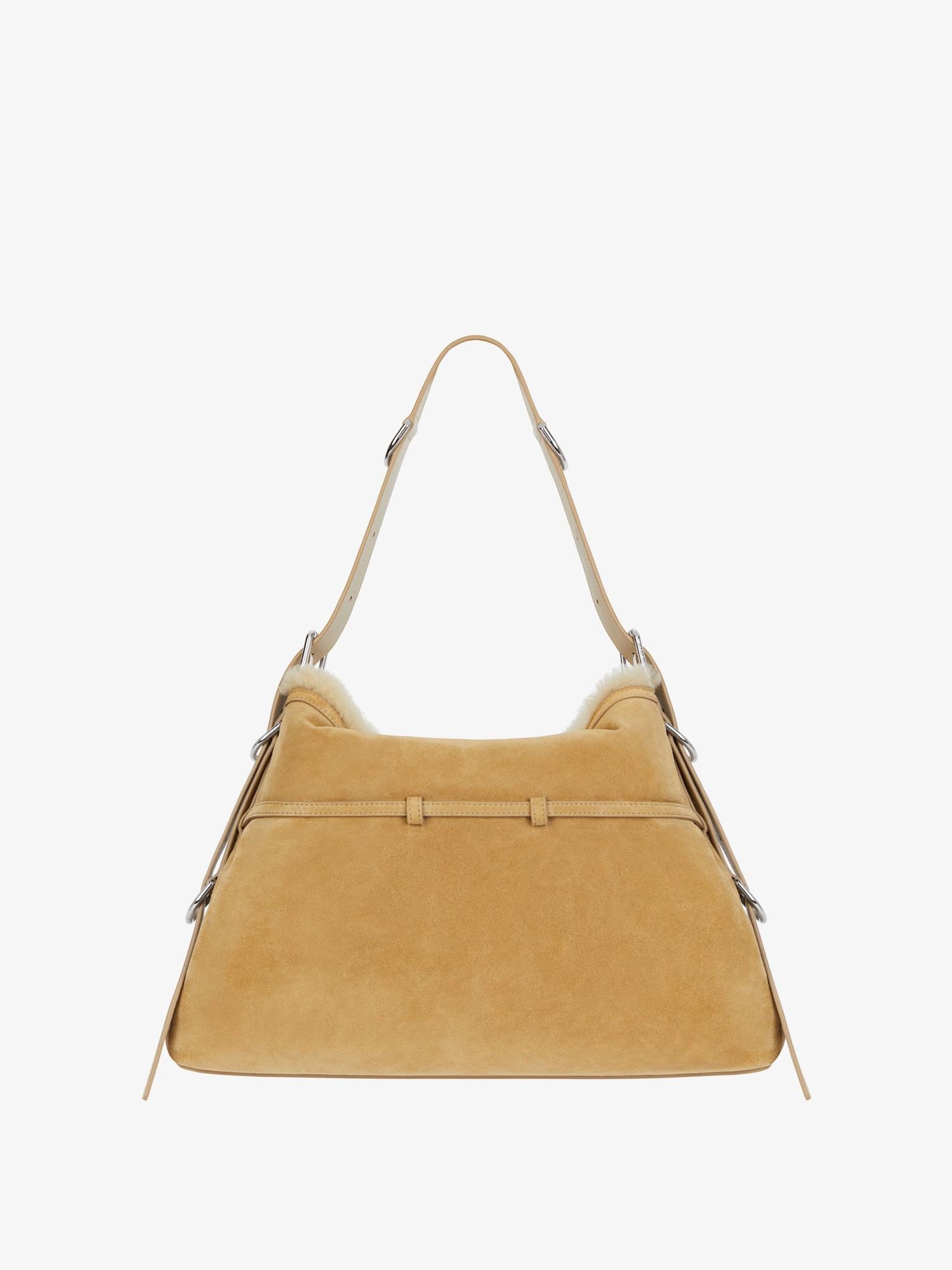 Medium Voyou bag in suede and shearling Product Image
