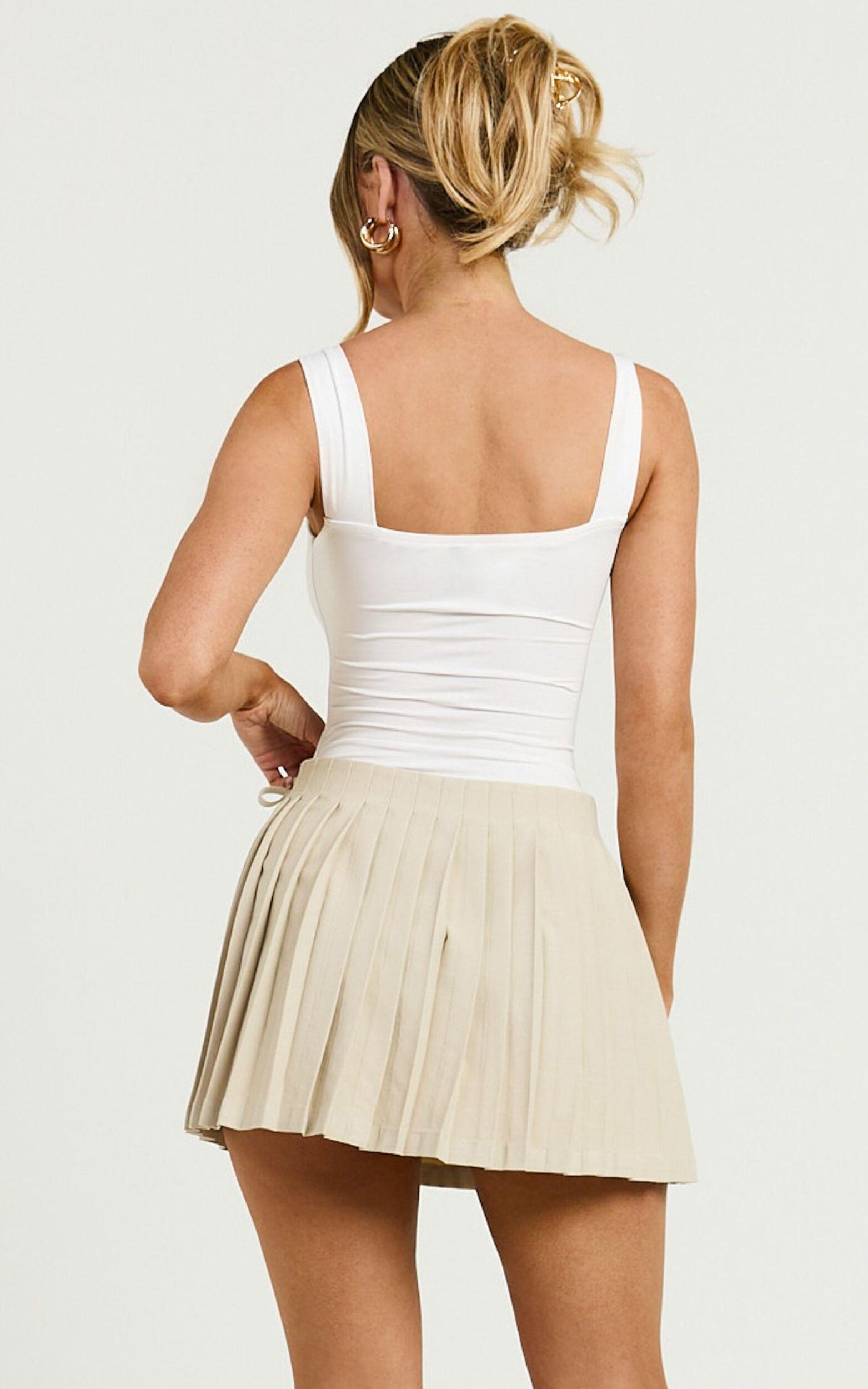 Camilla Mini Skirt - Mid Waist Pleated Back Bow Detail Skirt in Stone Product Image