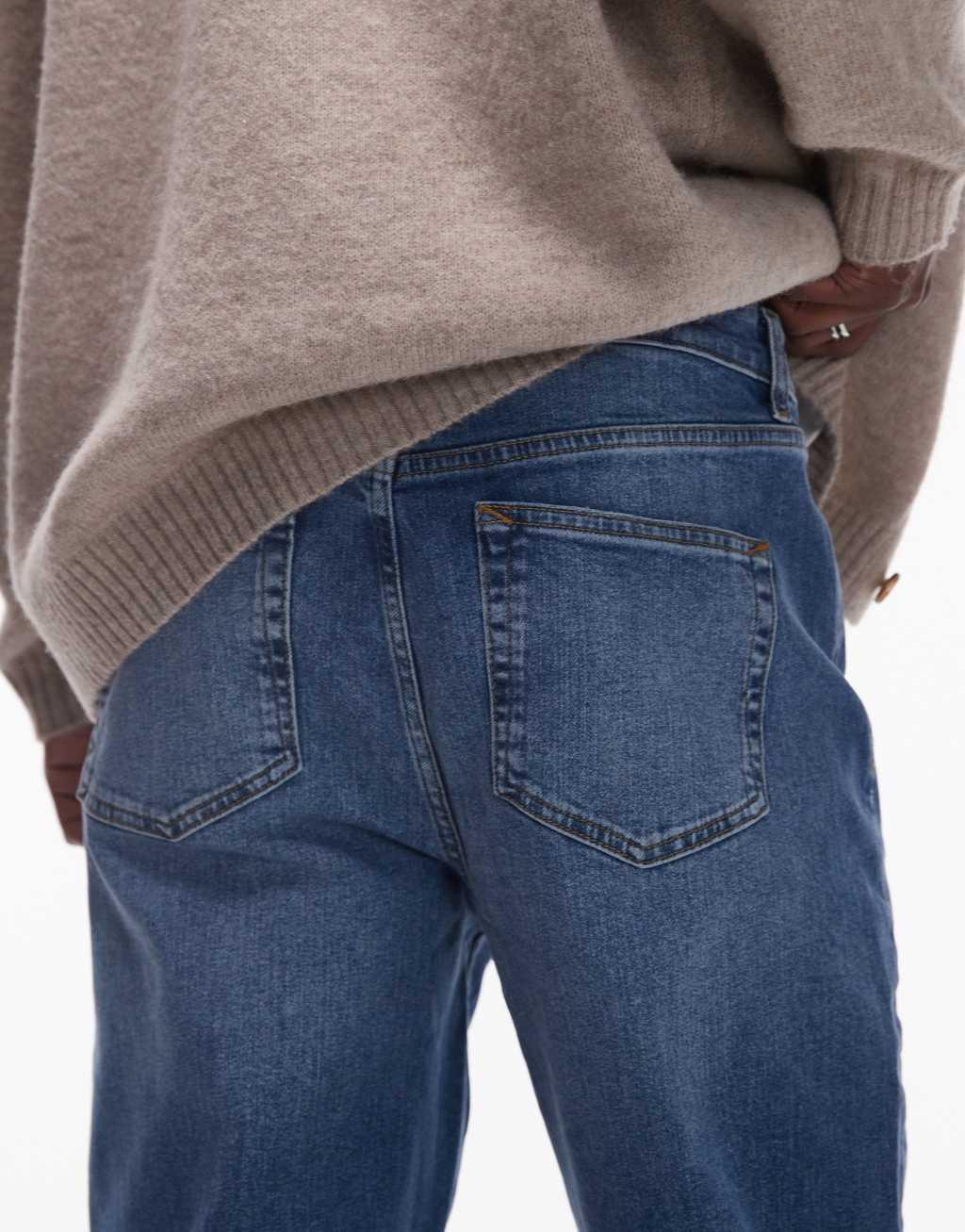 Topman stretch tapered jeans in mid wash blue Product Image