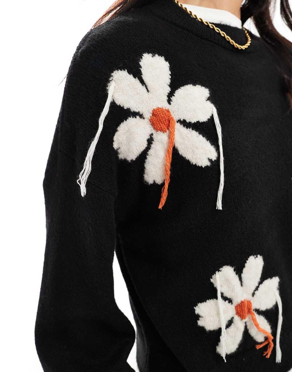 ASOS DESIGN knit sweater with tassel floral in black Product Image