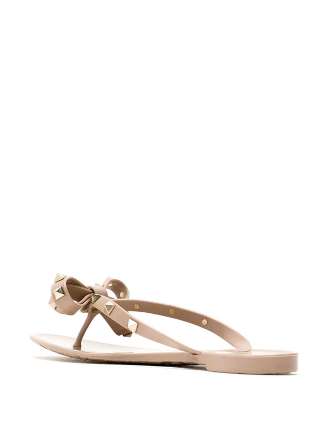 VALENTINO GARAVANI Women Rockstud Rubber Flip Flops In Beige Product Image