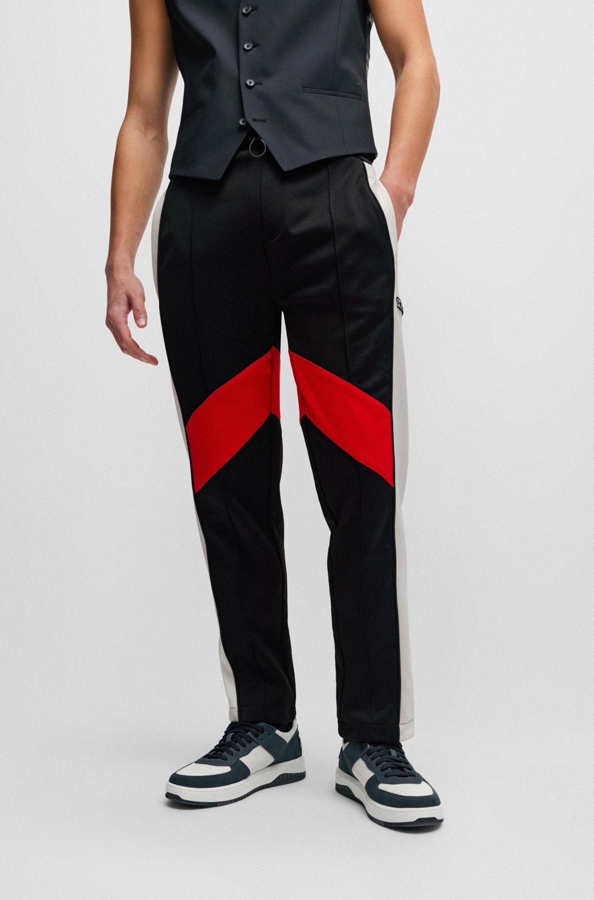 Relaxed-fit tracksuit bottoms with color-blocking Product Image