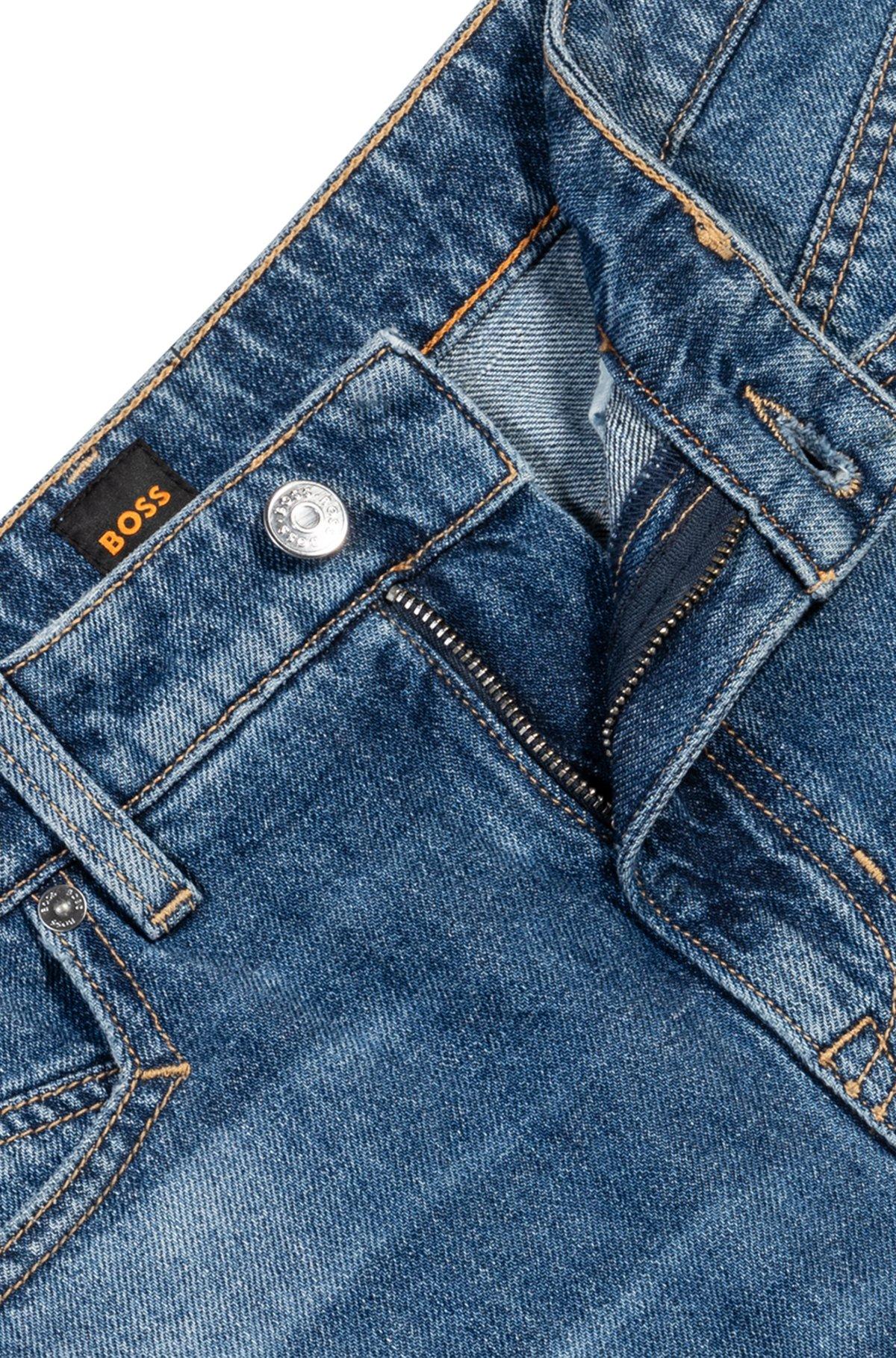 Knee-length denim shorts with raw hem Product Image