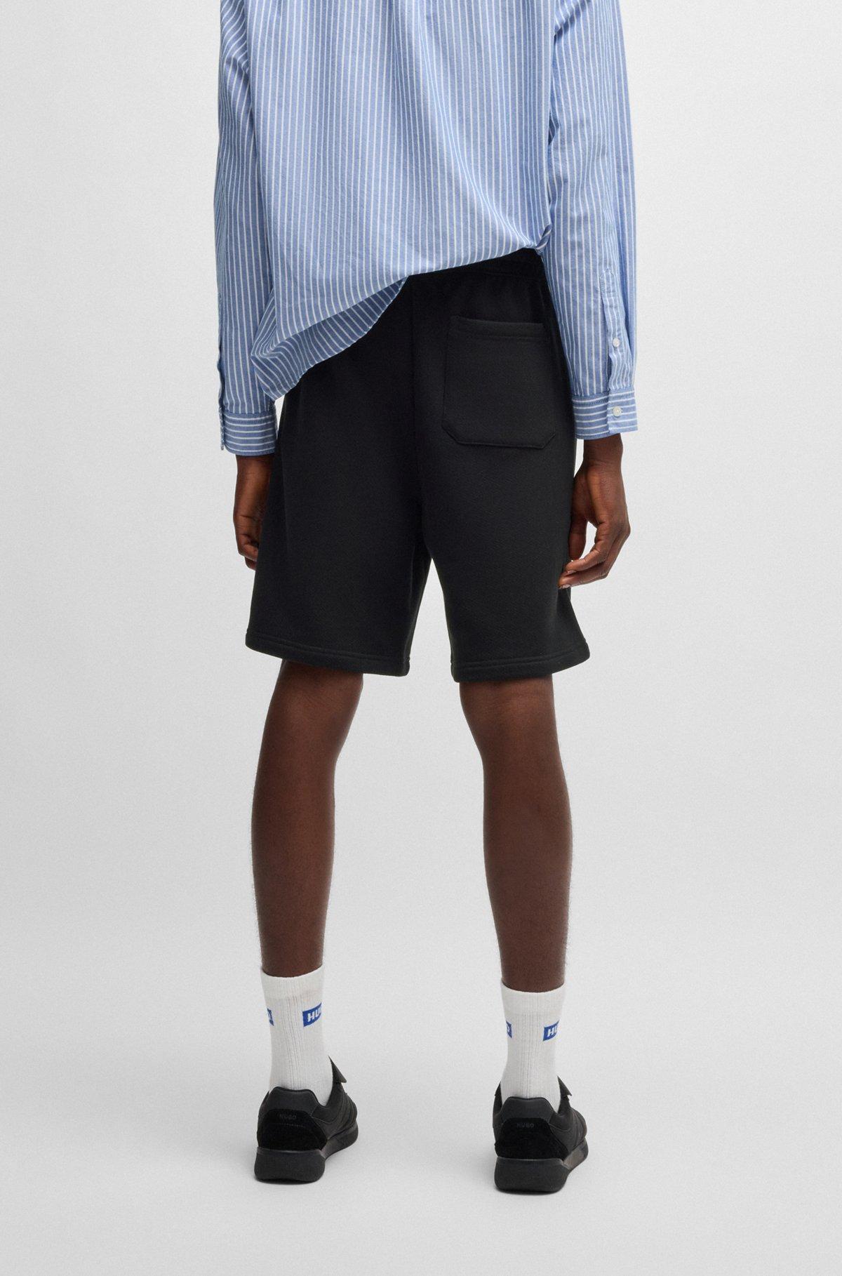 Loose-fit shorts in cotton terry with logo print Product Image