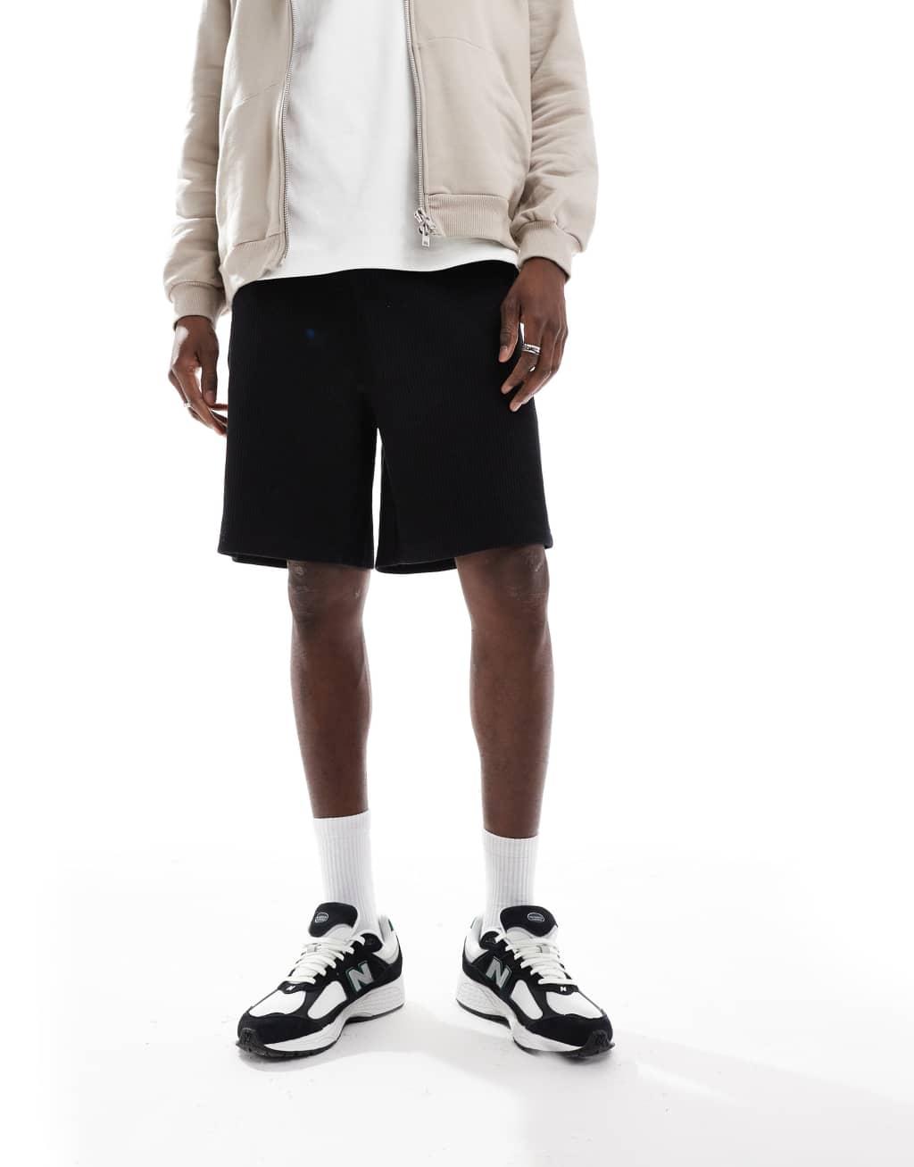 ASOS DESIGN oversized shorts in waffle textured black Product Image