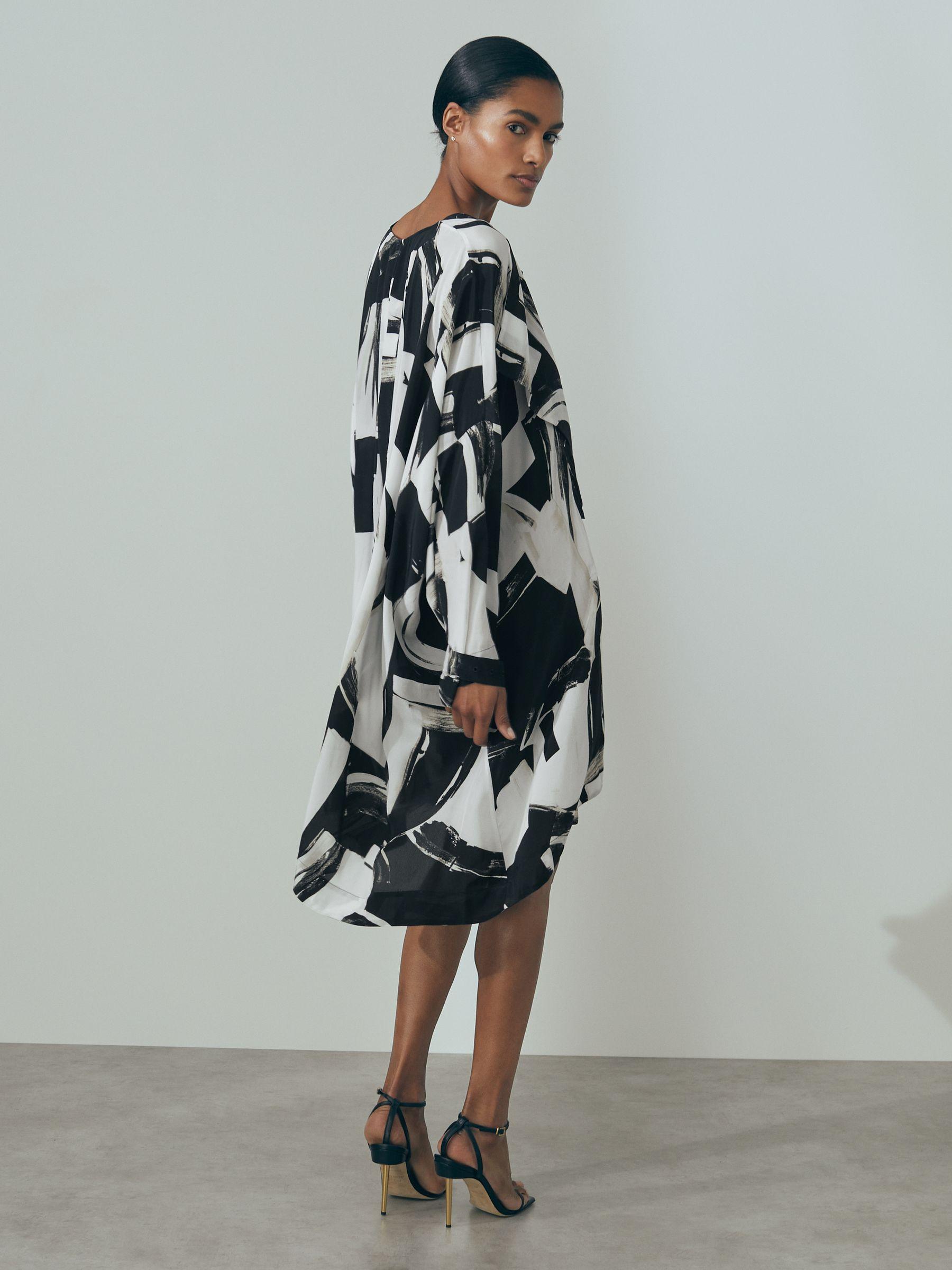 Atelier Italian Cape Sleeve Mini Dress in White/Black Product Image