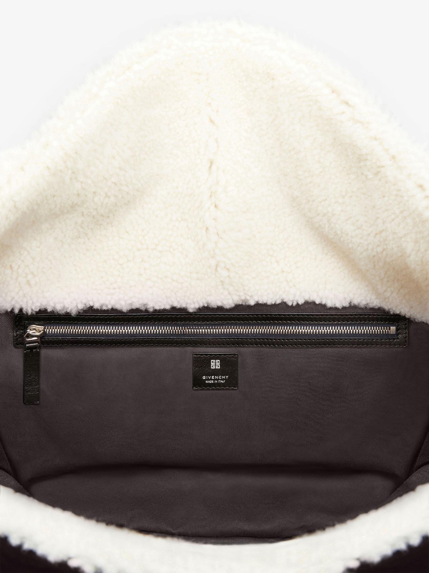Large Voyou bag in shearling Product Image