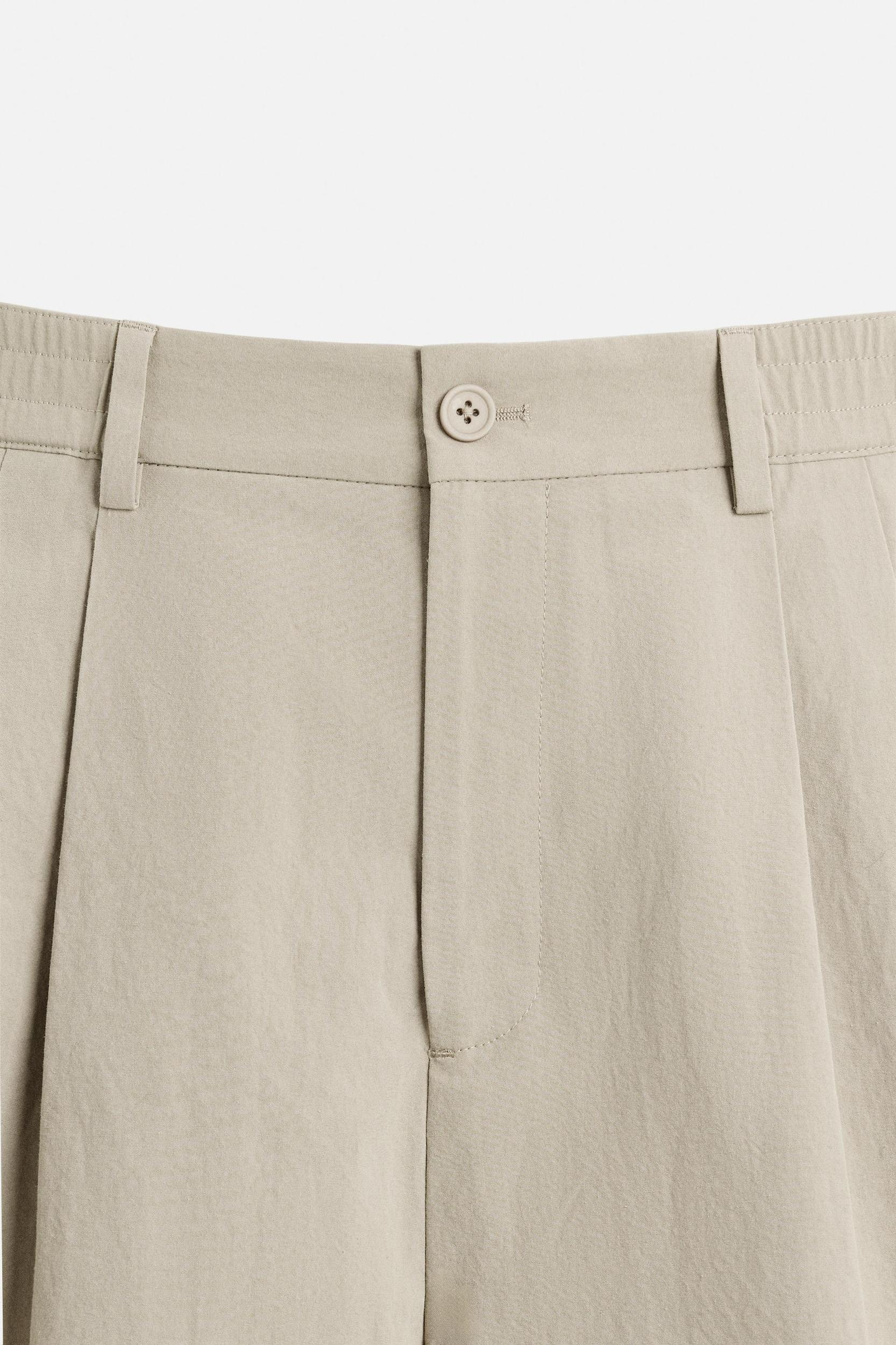 PLEATED CHINO PANTS Product Image