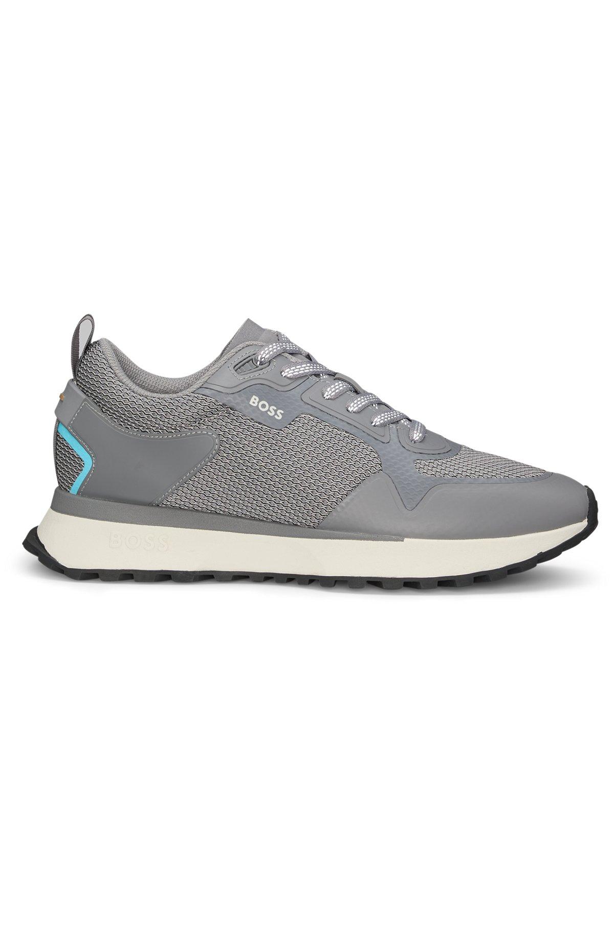 Mixed-material trainers with mesh details and branding Product Image