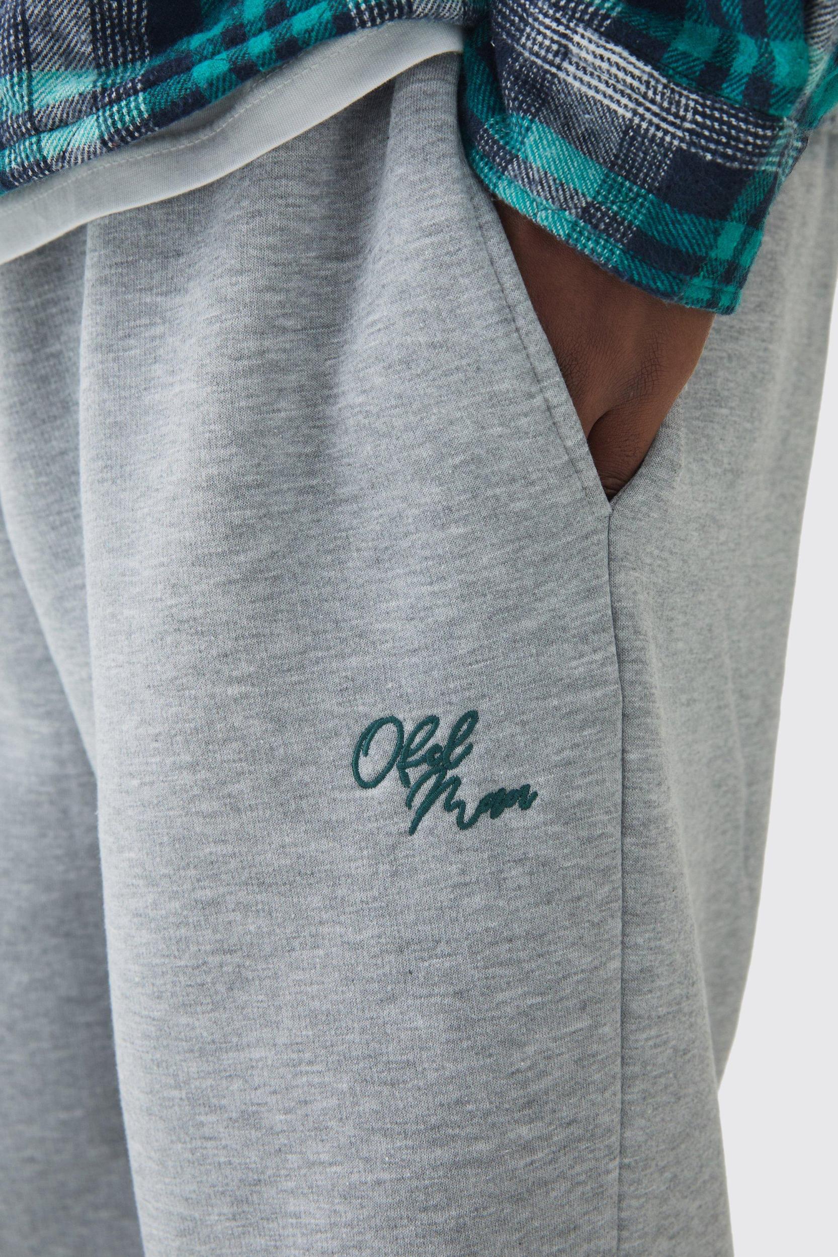 Plus Brushed Back Embroidered Split Hem Relaxed Sweatpants | boohooMAN USA Product Image