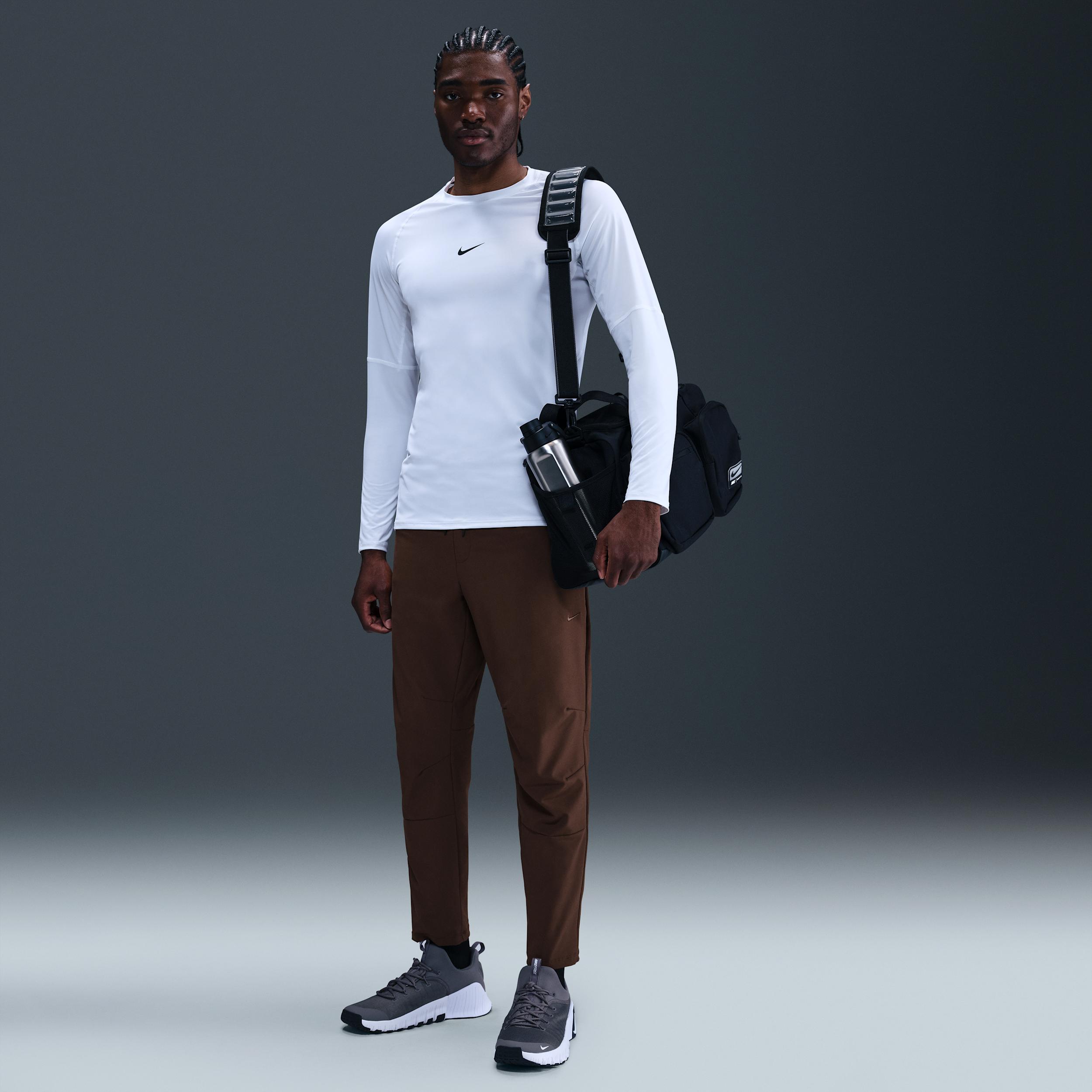 Nike Mens Unlimited Dri-FIT Tapered Leg Versatile Pants | FB7546-237 Product Image