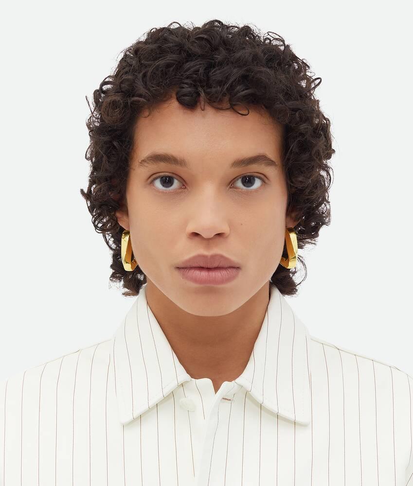 Women's Large Twist Triangle Hoop Earrings in Yellow gold Product Image