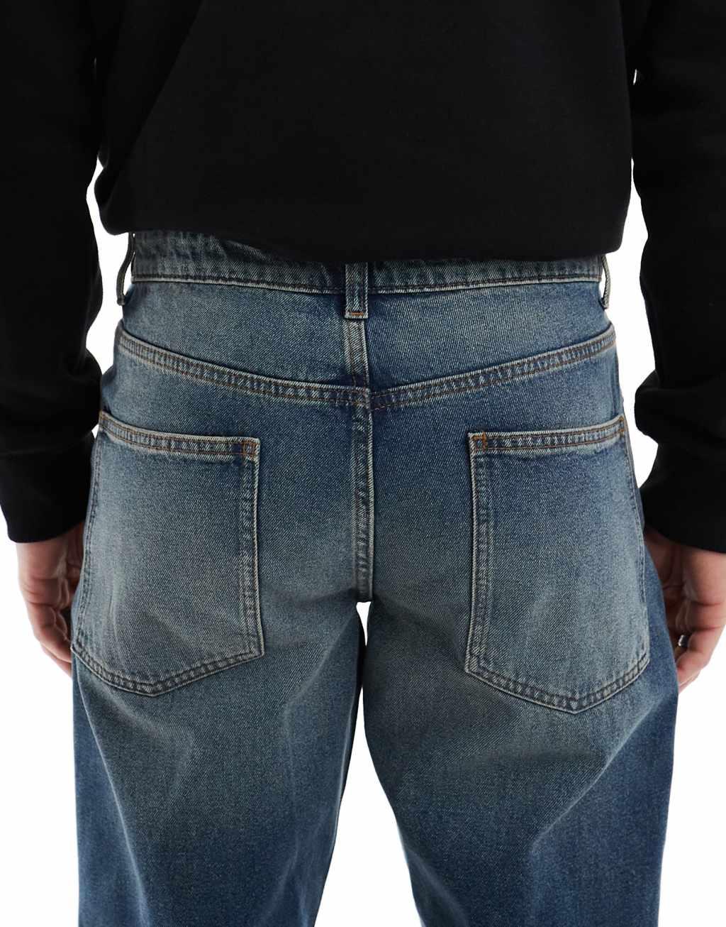 ASOS DESIGN tapered jeans with vintage tint in dark wash blue Product Image