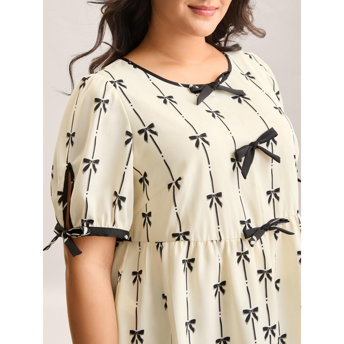 Plus Size Beige Bow Detail Printed Color Contrast Blouse Women Romantic Half Sleeve V-neck Elegant Blouses BloomChic 30/6X Product Image