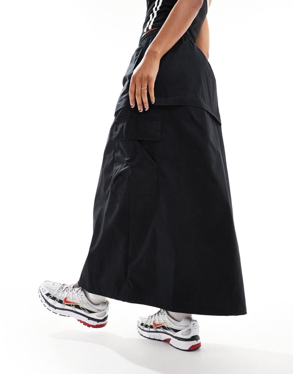 Nike Woven 2 n 1 maxi and mini skirt with zip detail in black Product Image