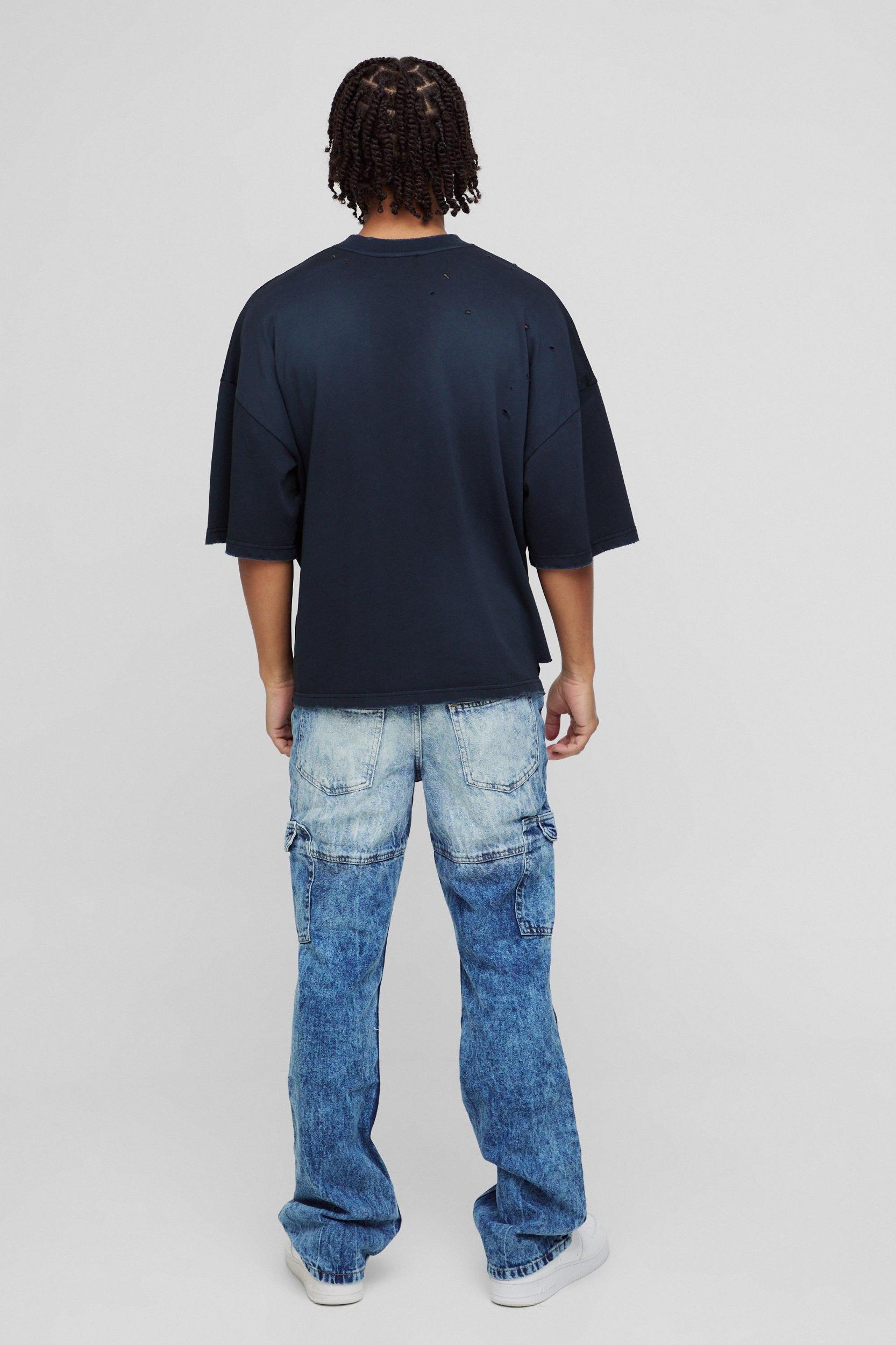 Slim Flared Acid Wash Panel Cargo Jeans | boohooMAN USA Product Image