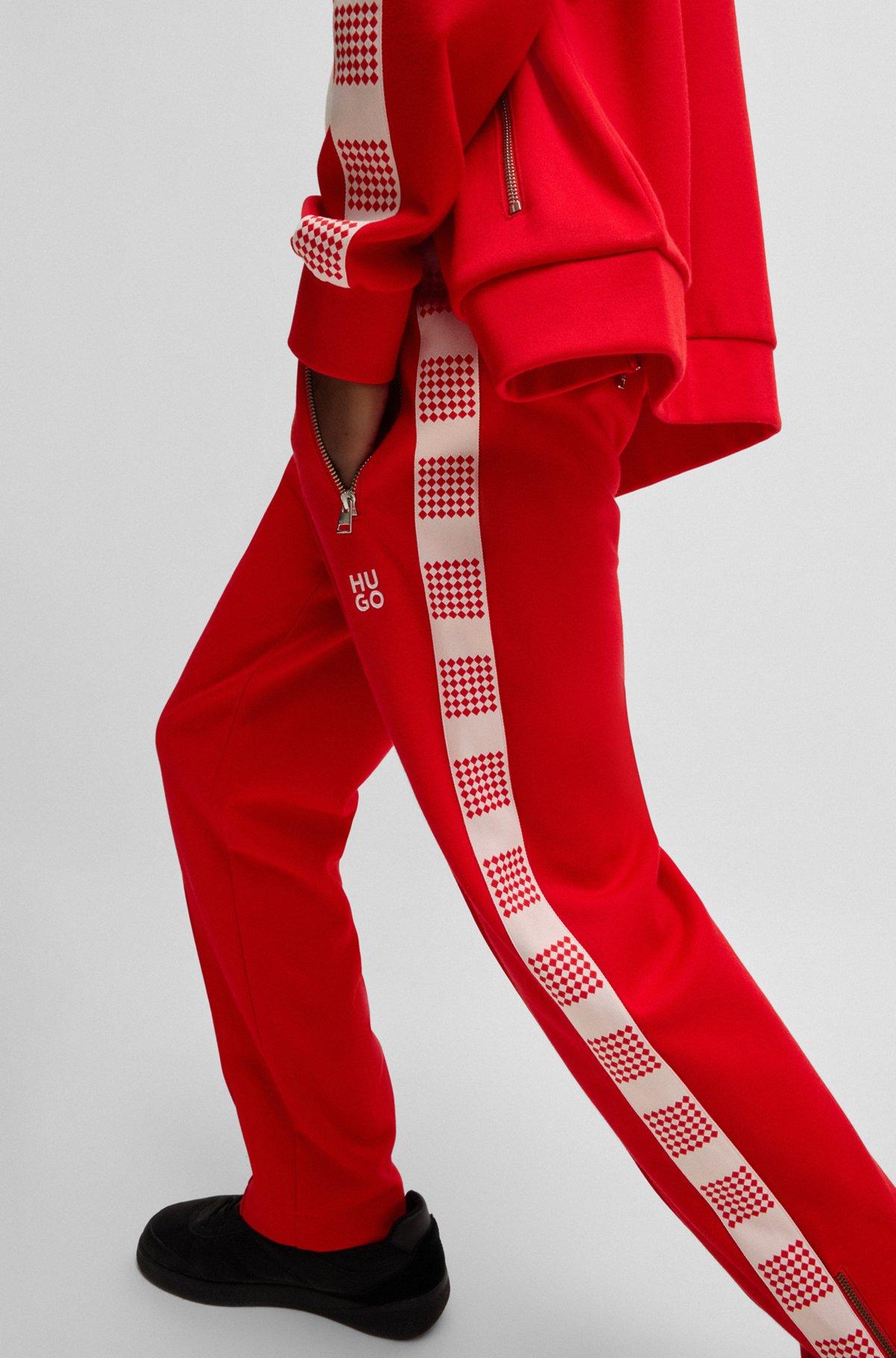 HUGO - Tracksuit bottoms with checked tape - light pink Product Image