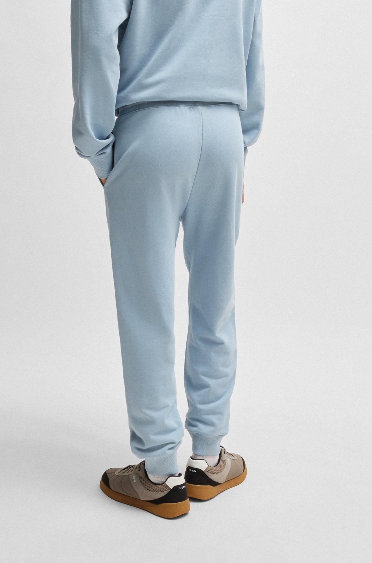 Cuffed tracksuit bottoms in cotton terry with logo print Product Image