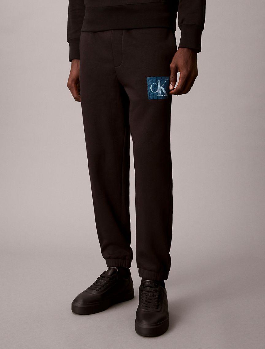 Fleece Layered Monogram Graphic Sweatpants Product Image