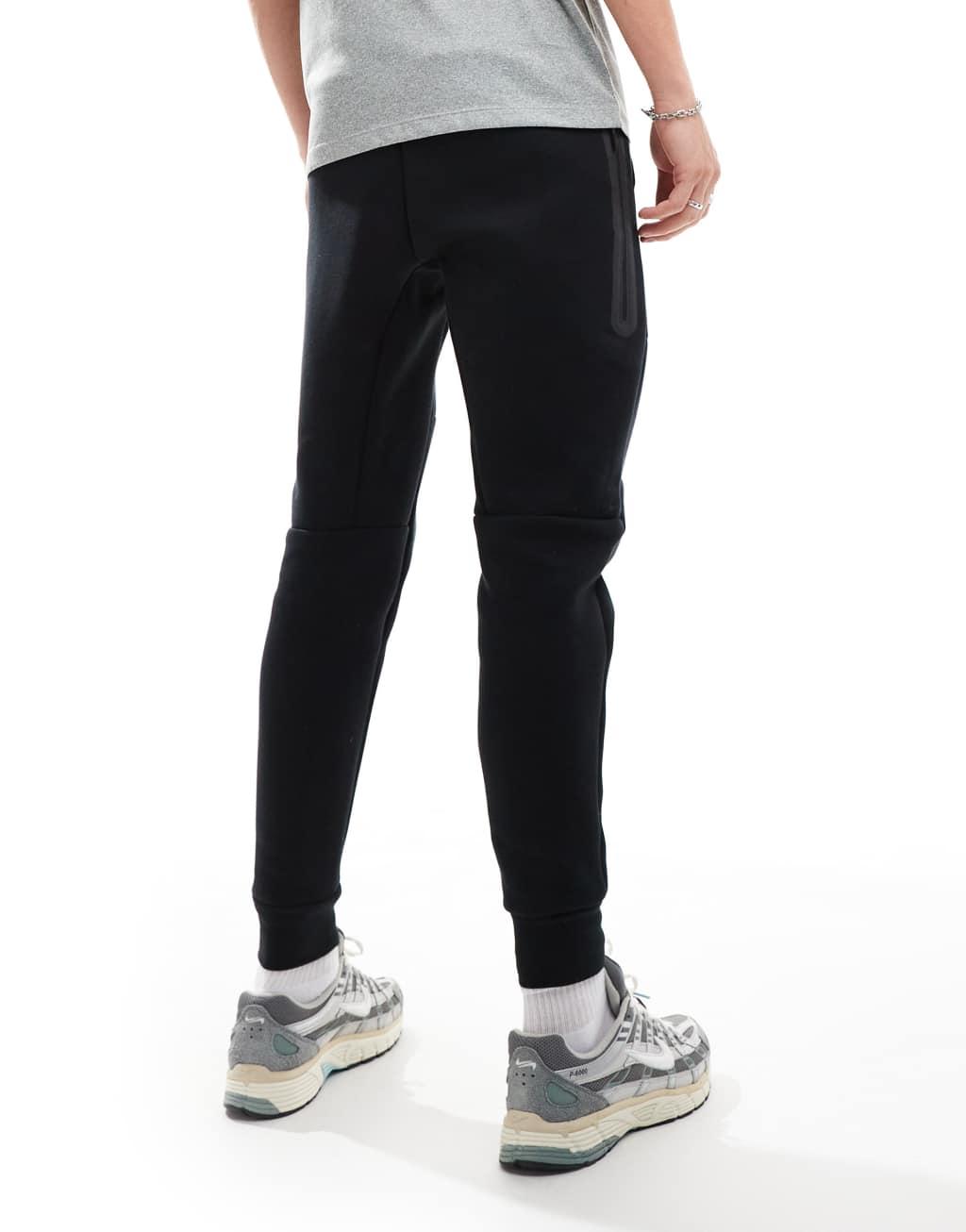 Nike Tech Fleece cuffed joggers in black Product Image