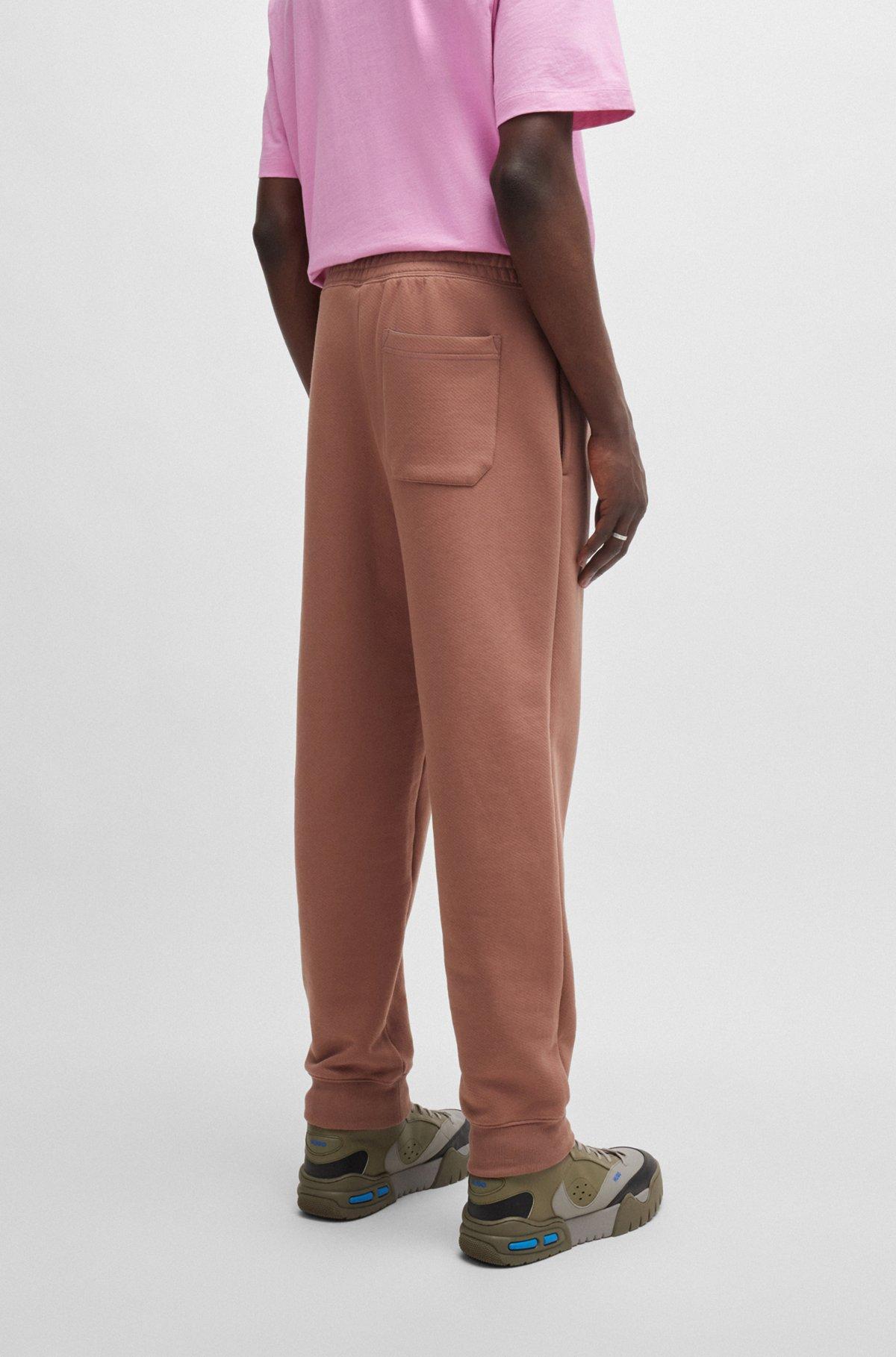 Cotton-terry tracksuit bottoms with logo print Product Image