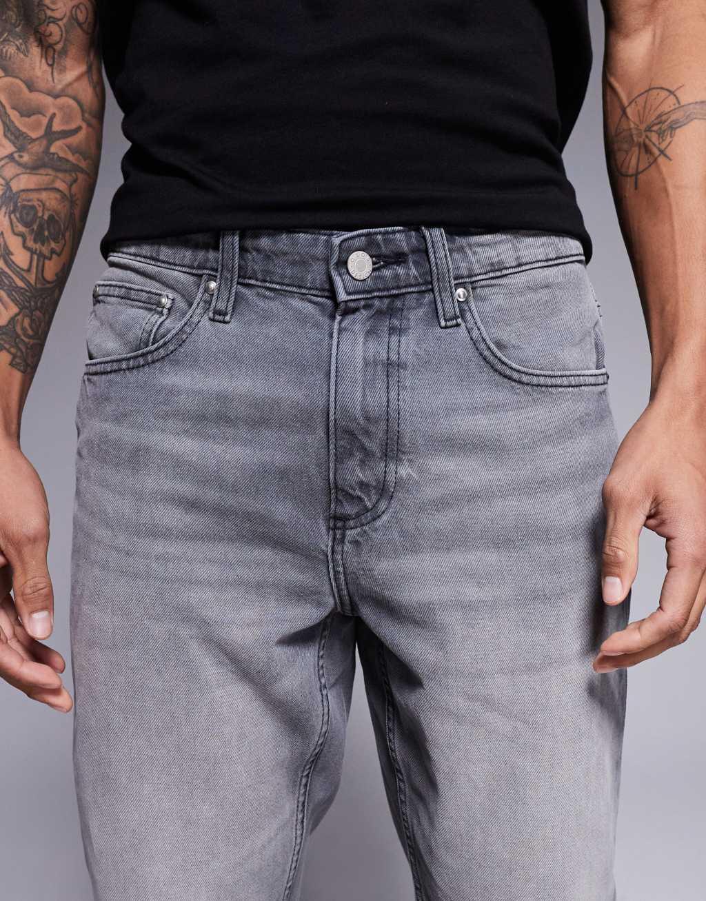 ASOS DESIGN tapered fit jeans in washed black  Product Image
