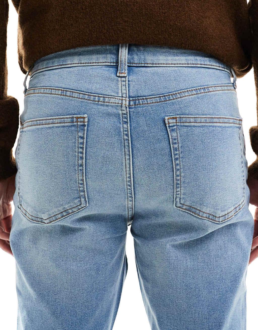 ASOS DESIGN stretch flare jeans in light wash blue Product Image