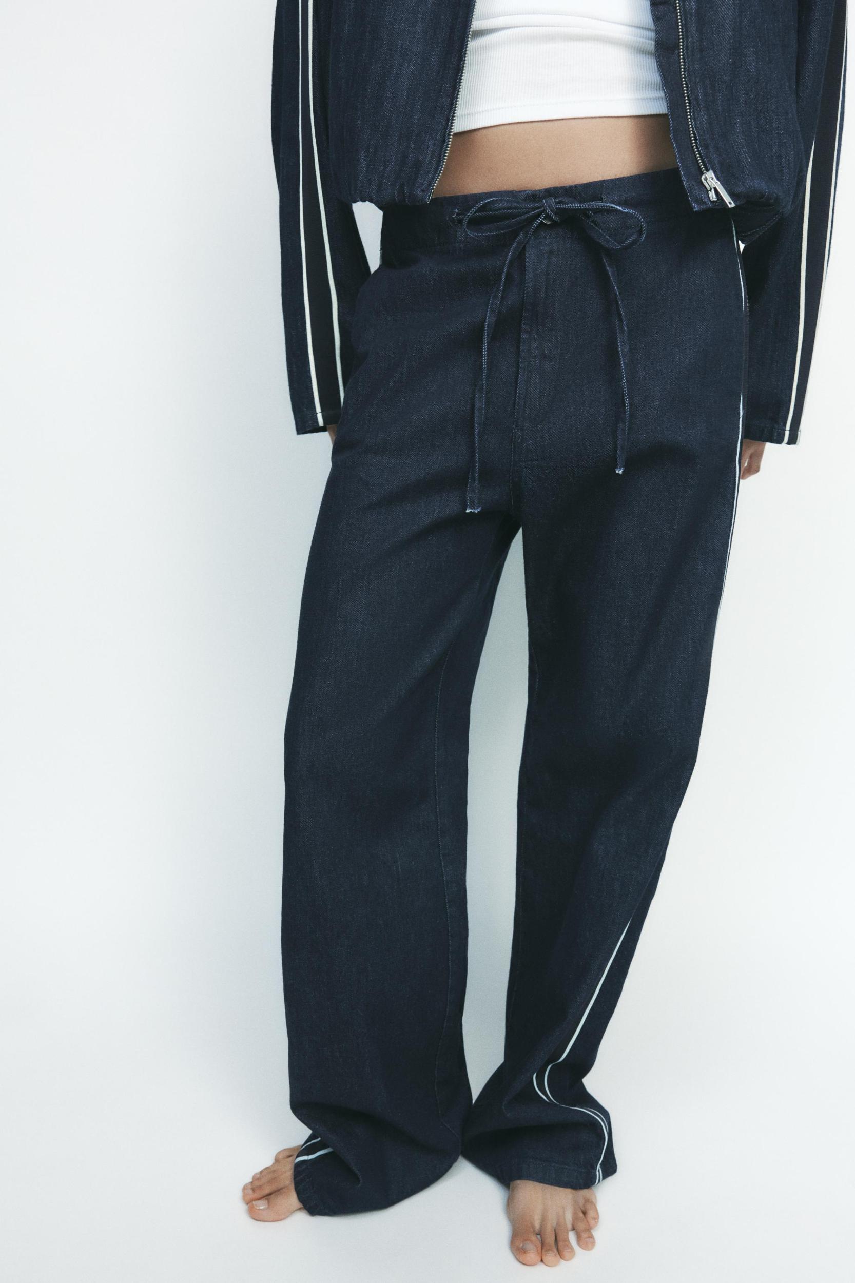 DENIM PANTS WITH SIDE BANDS Product Image