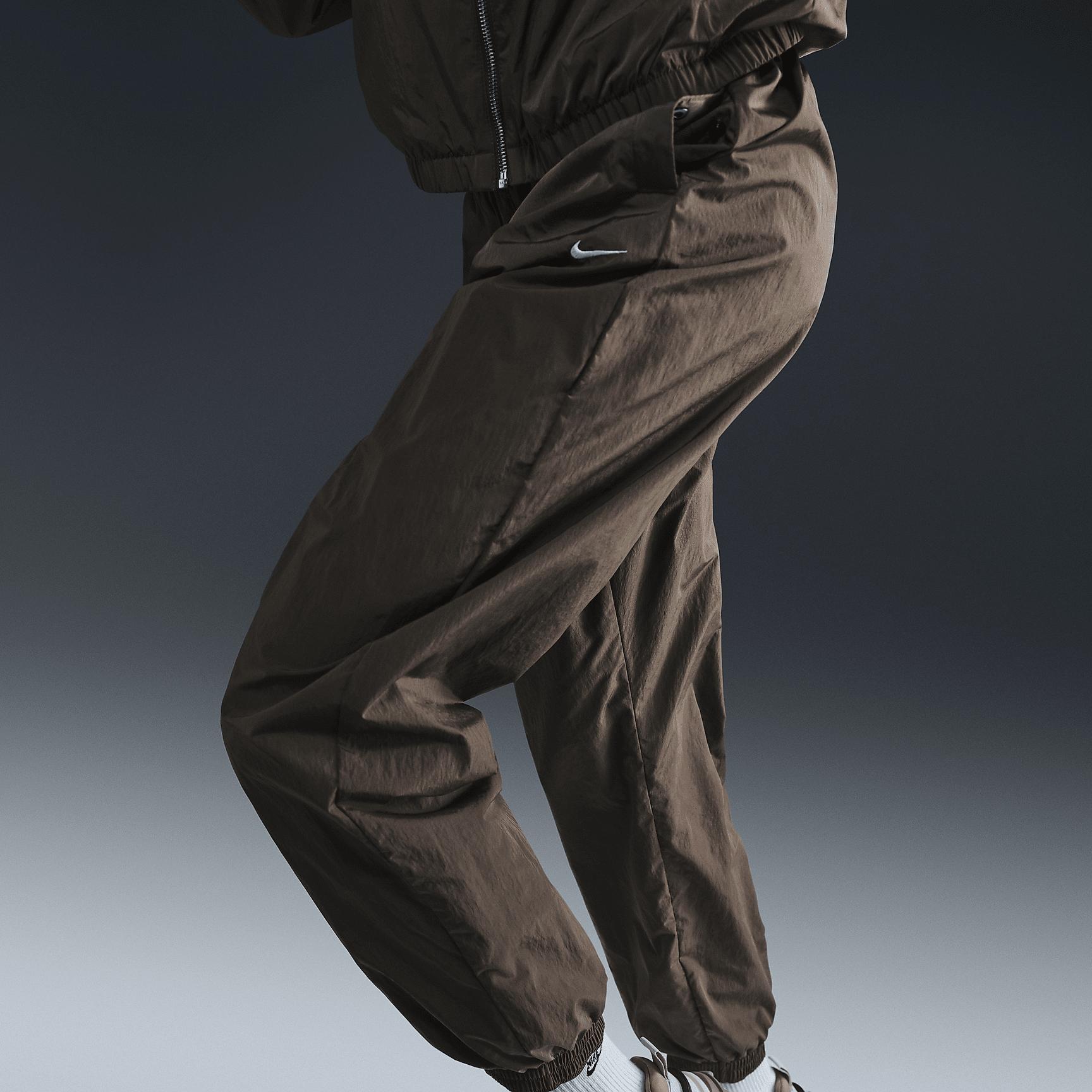 Womens Nike Sportswear Essential Mid-Rise Oversized Woven Jogger Pants | FV7668-004 Product Image