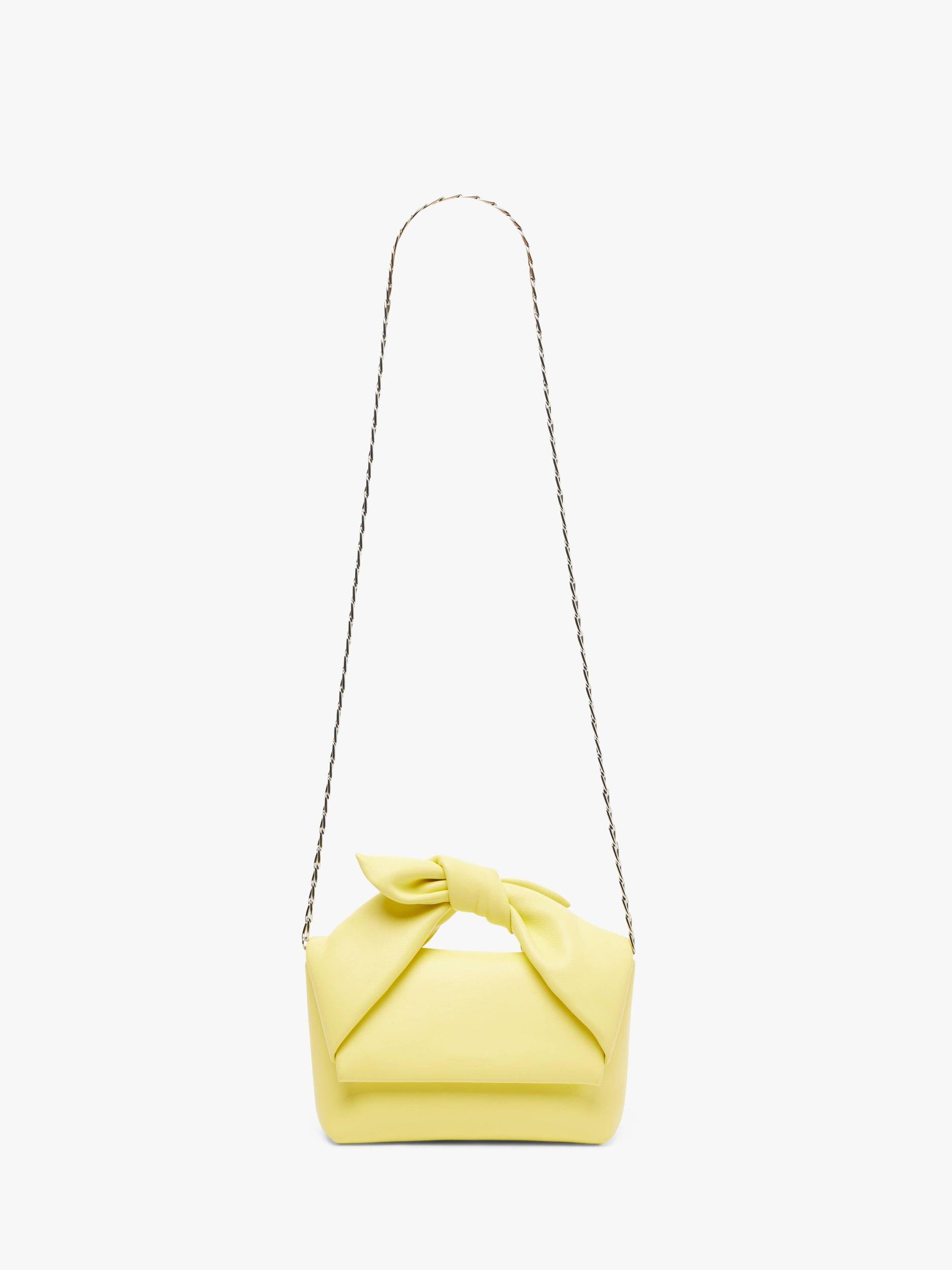 MEDIUM BOW TWISTER - LEATHER TOP HANDLE BAG Product Image