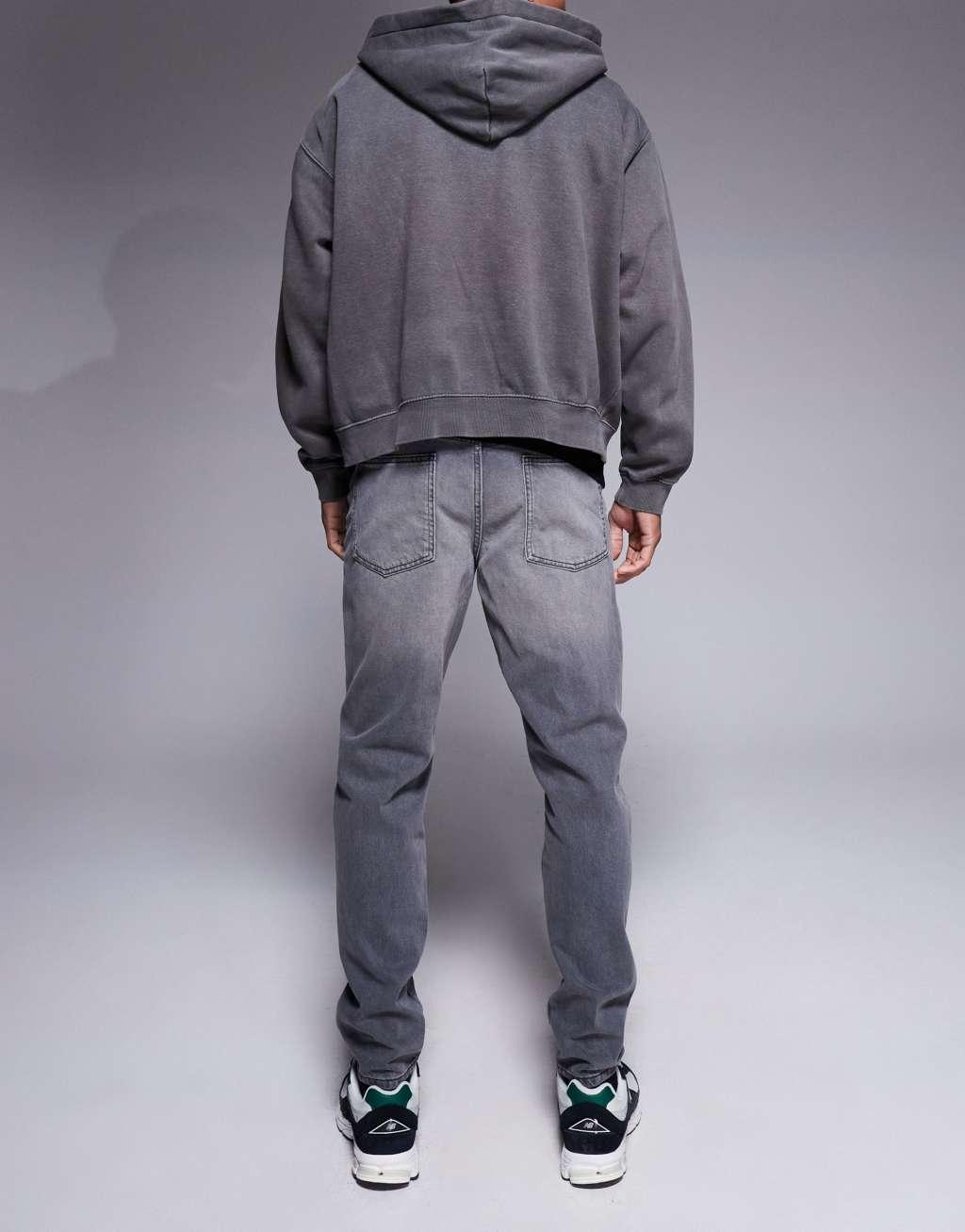 ASOS DESIGN tapered fit jeans in washed black  Product Image