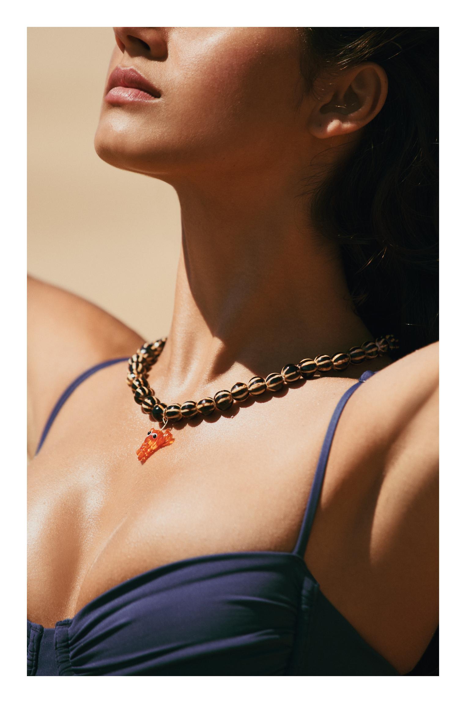 Beaded necklace with lobster pendant Product Image