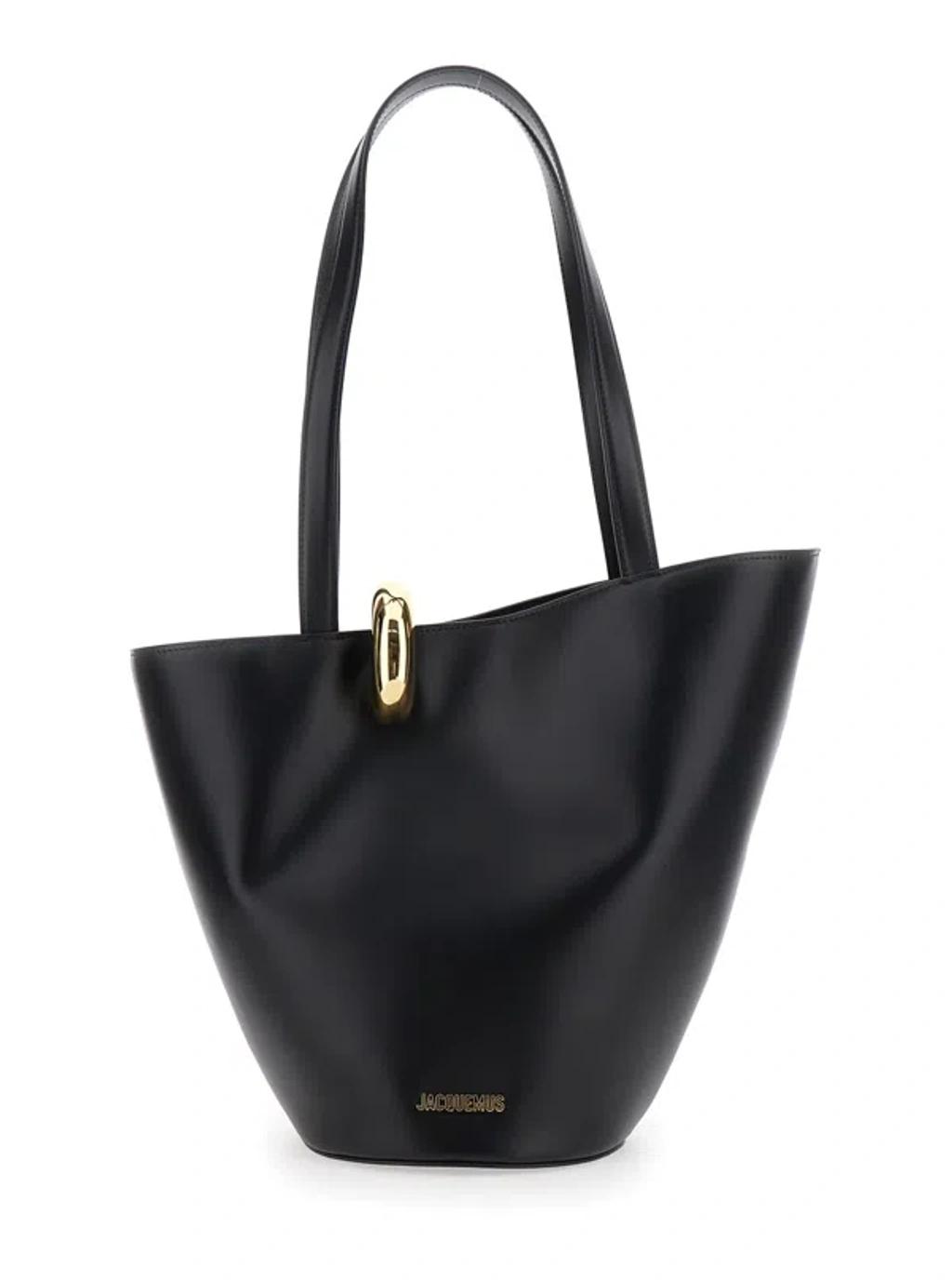 JACQUEMUS The Medium Bambola Asymmetric Leather Bucket Bag In Black 990 Product Image