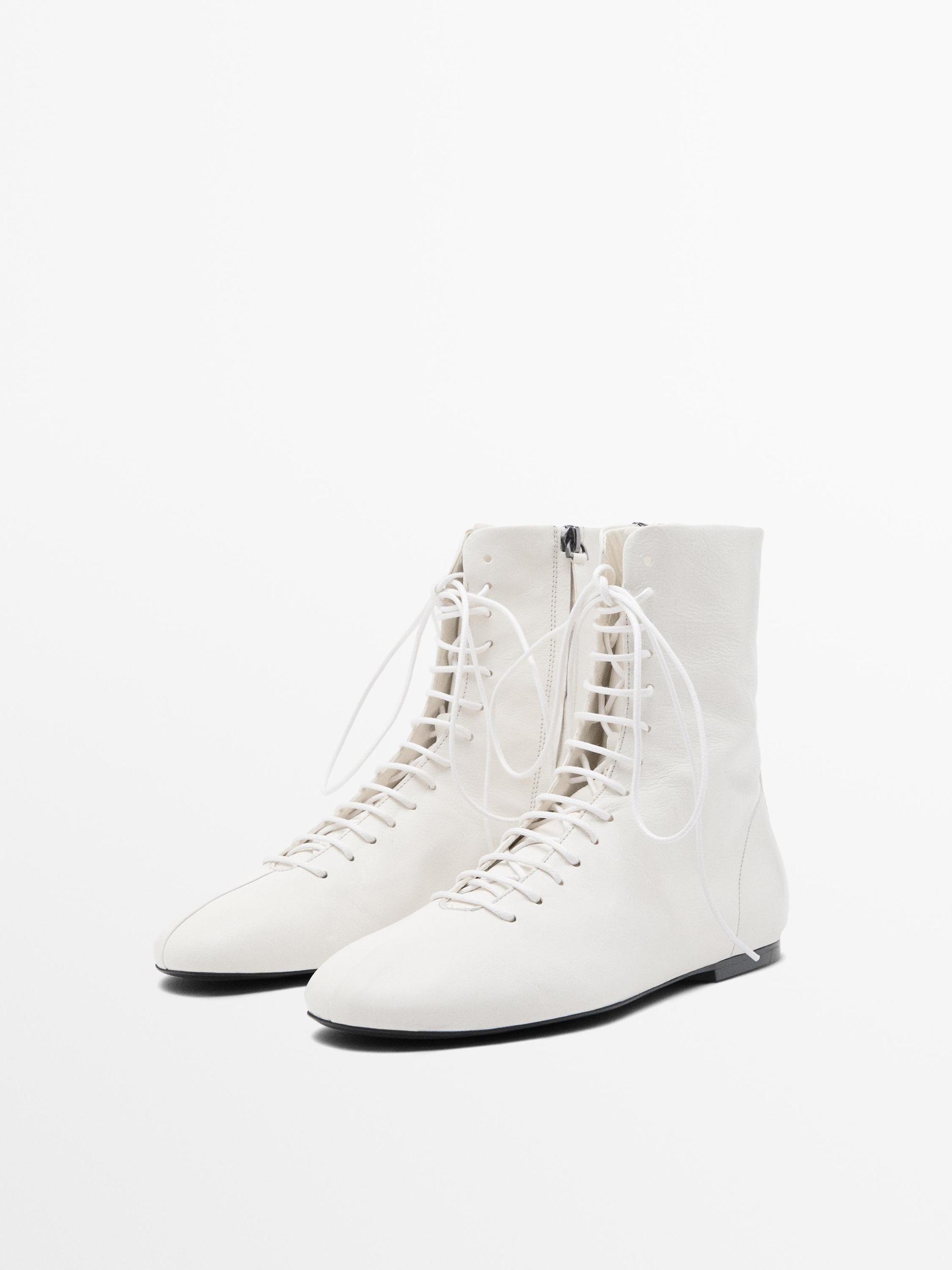 Lace-up flat ankle boots Product Image