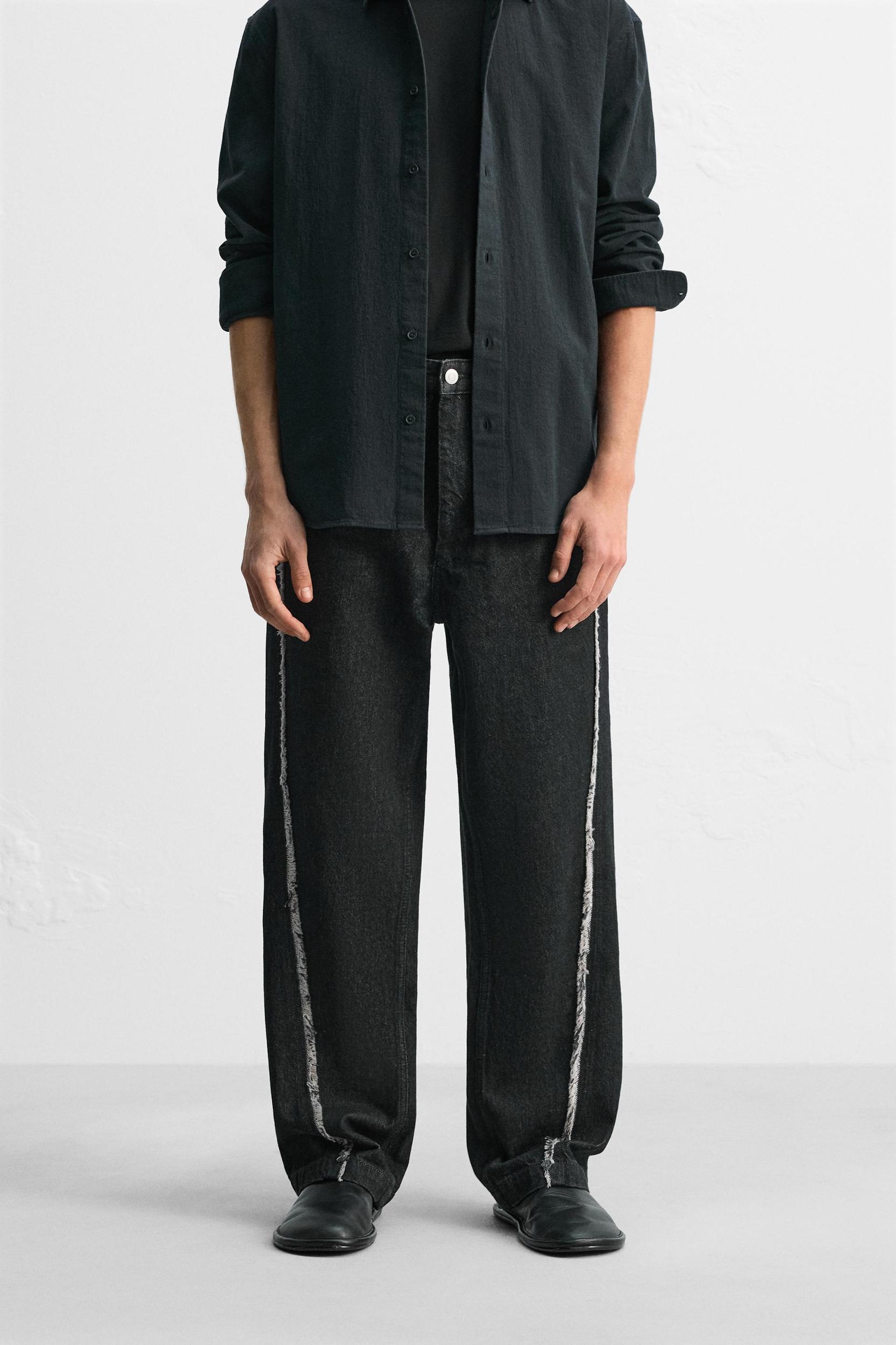 RELAXED FIT FRAYED SEAM JEANS Product Image