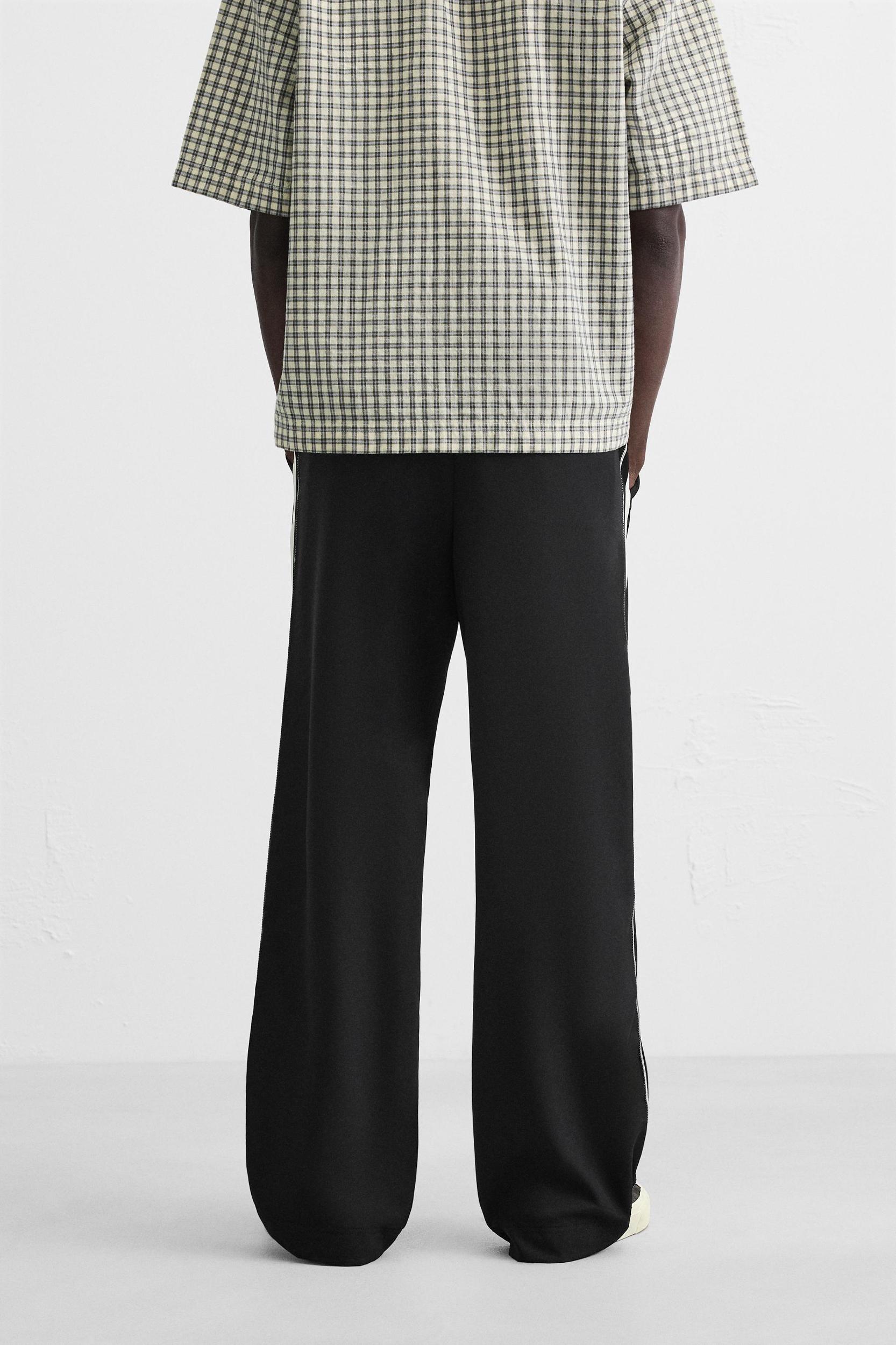 RELAXED FIT PANTS WITH CONTRASTING STRIPES Product Image