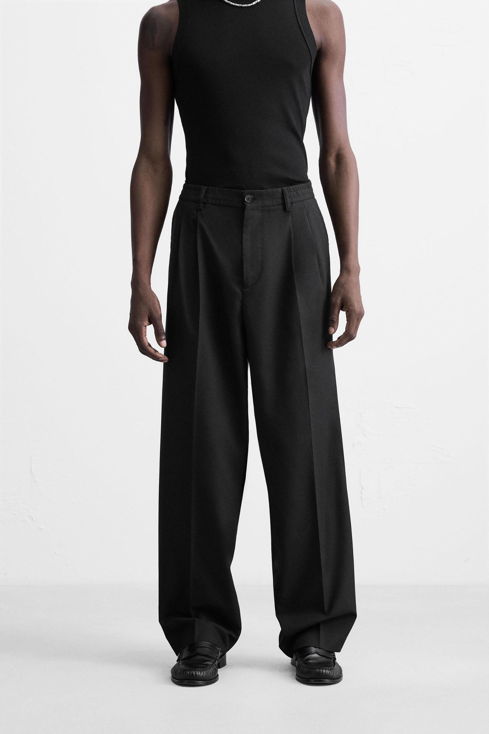 FLOWY PLEATED WIDE FIT PANTS Product Image