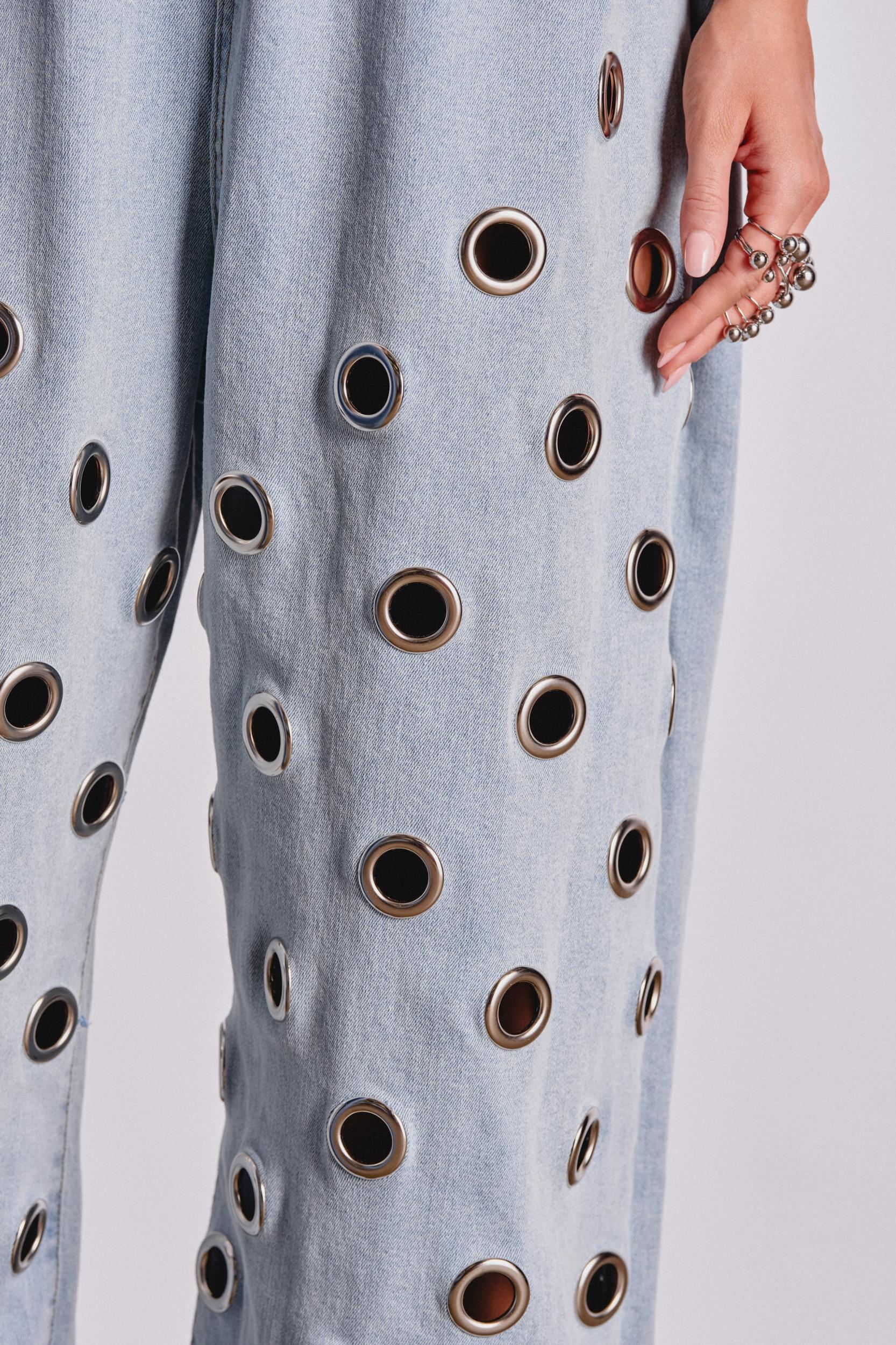 PLAY YOUR CARDS RIGHT DENIM JUMPSUIT WITH GROMMETS IN LIGHT WASH Product Image