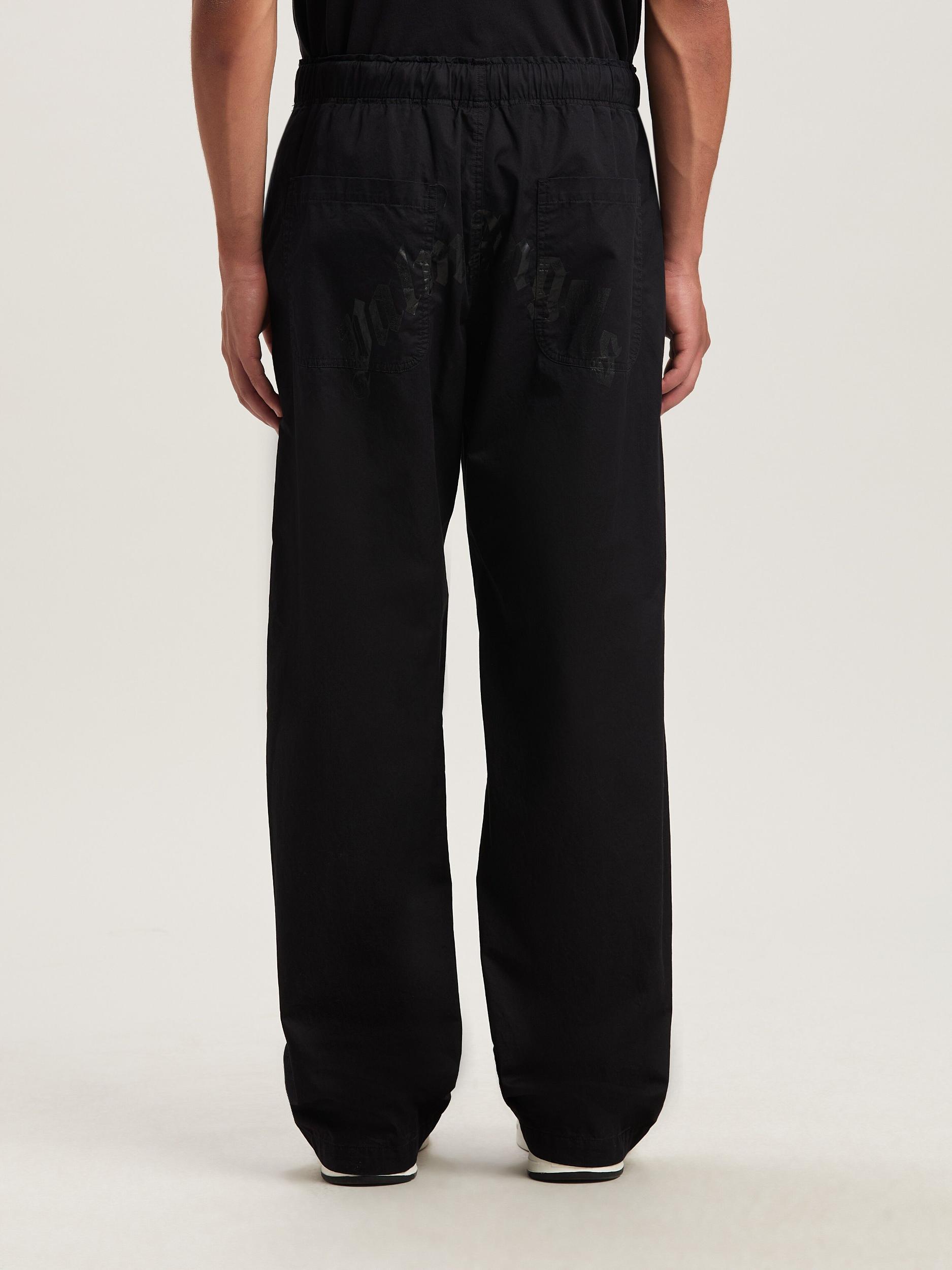 CURVED LOGO LOOSE PANTS Product Image