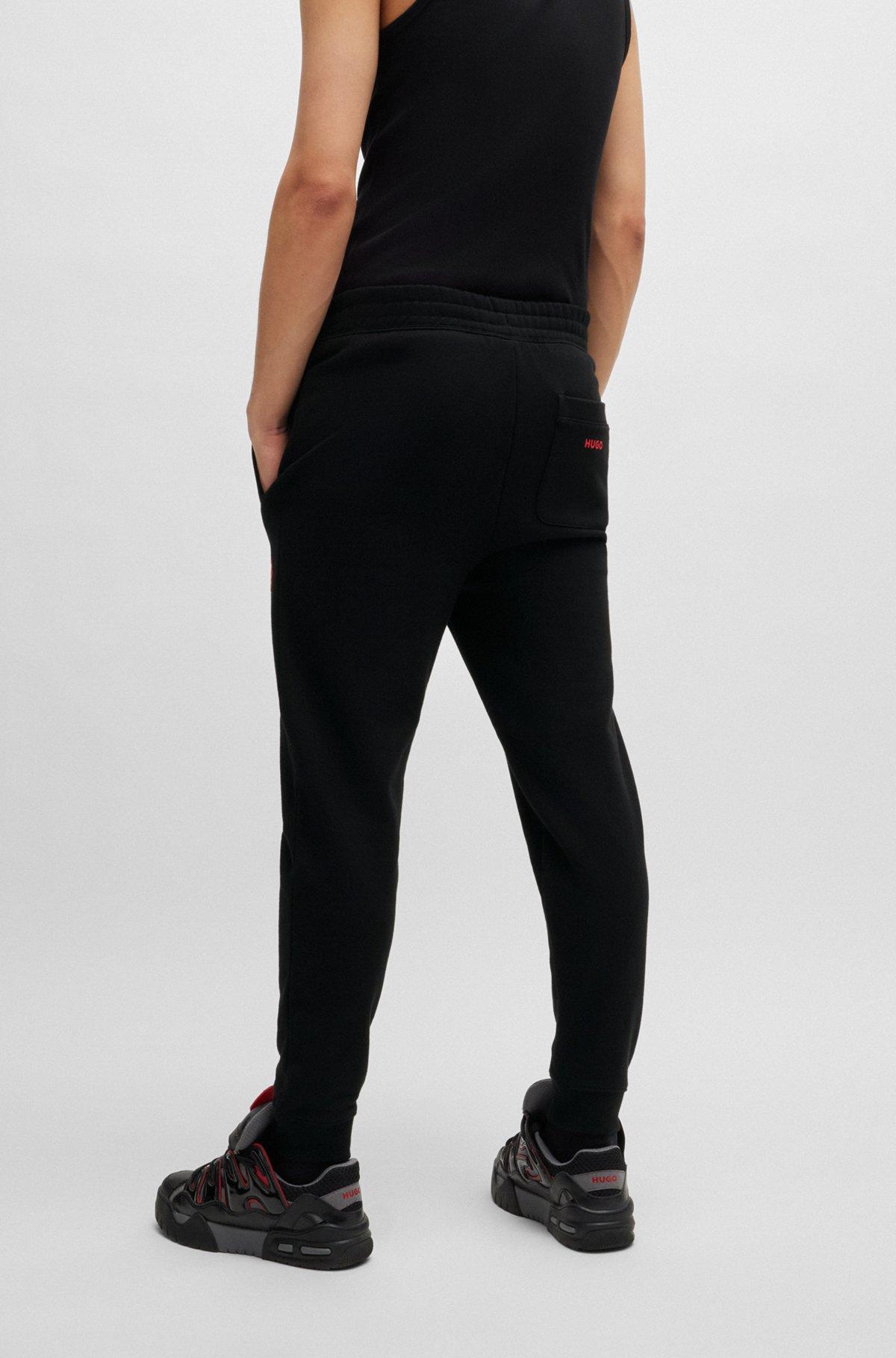 Cotton-terry tracksuit bottoms with puffed flame logo Product Image