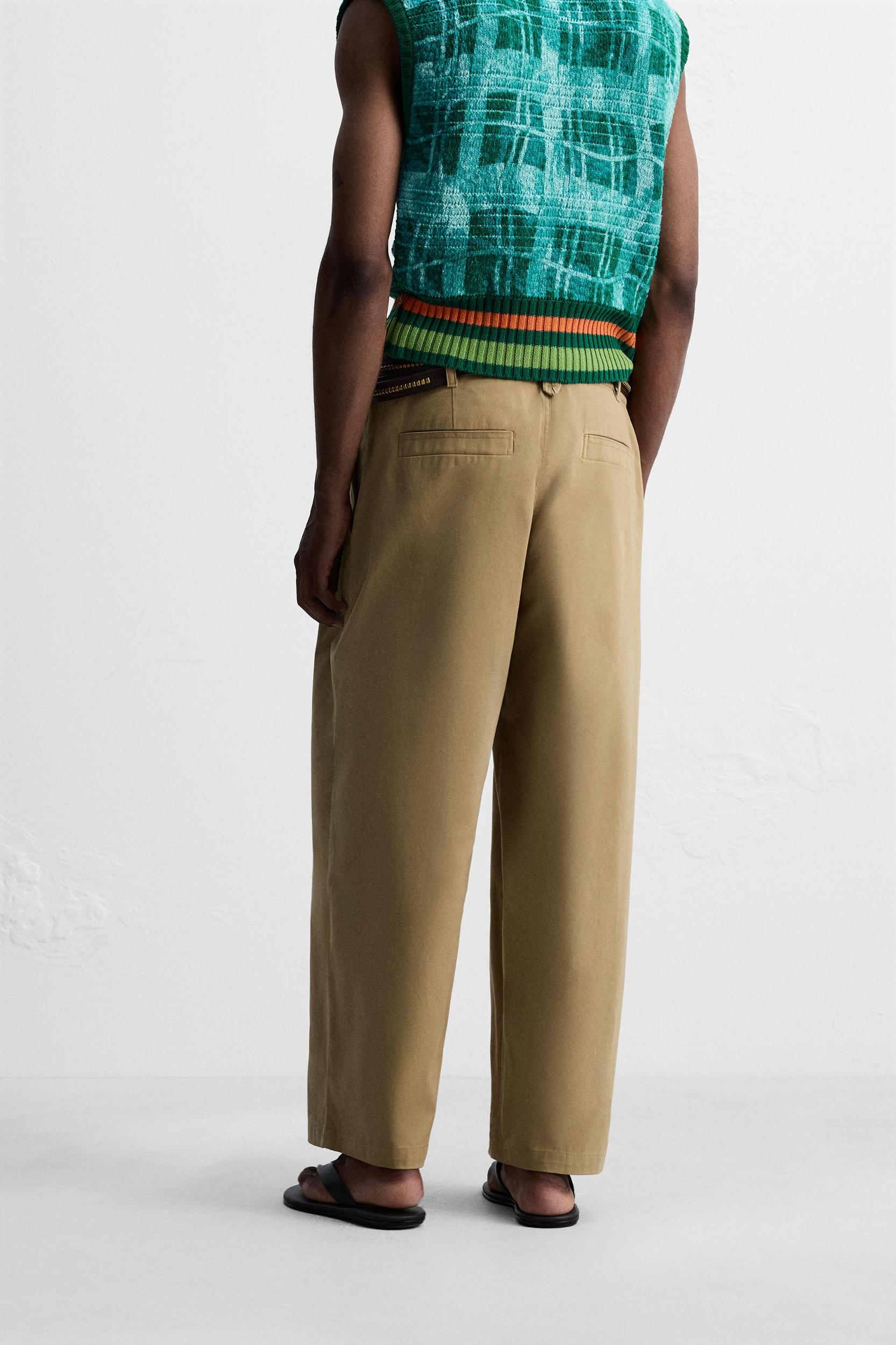 PLEATED WIDE FIT PANTS Product Image