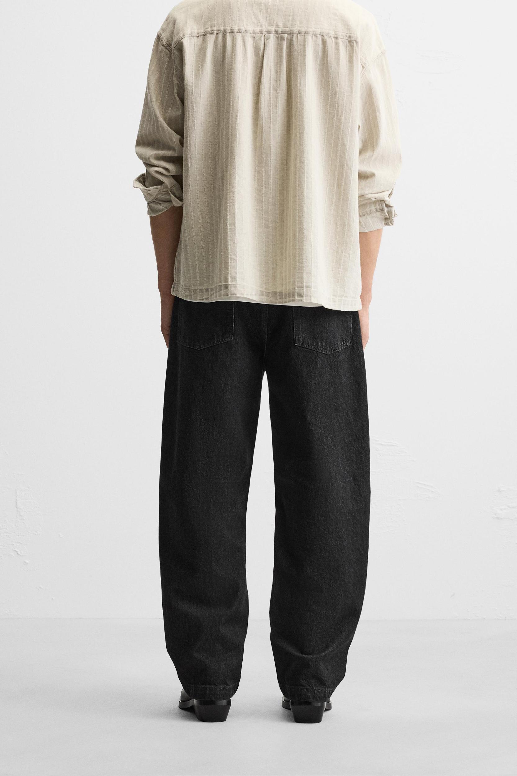 RELAXED FIT FRAYED SEAM JEANS Product Image