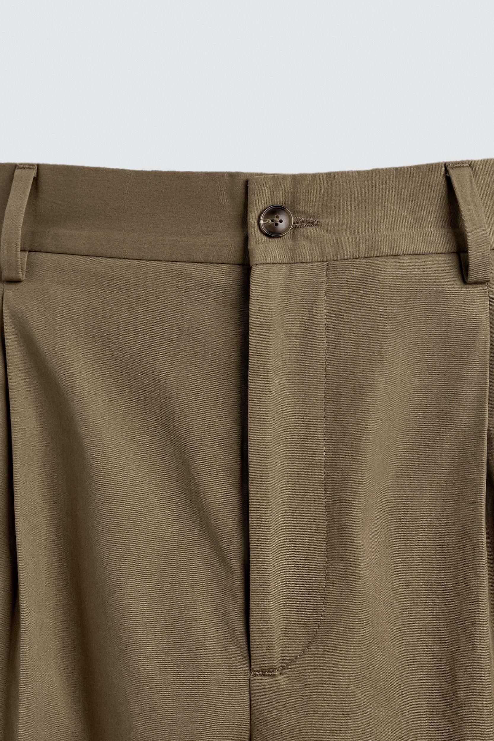 LIMITED EDITION RELAXED FIT PLEATED PANTS Product Image