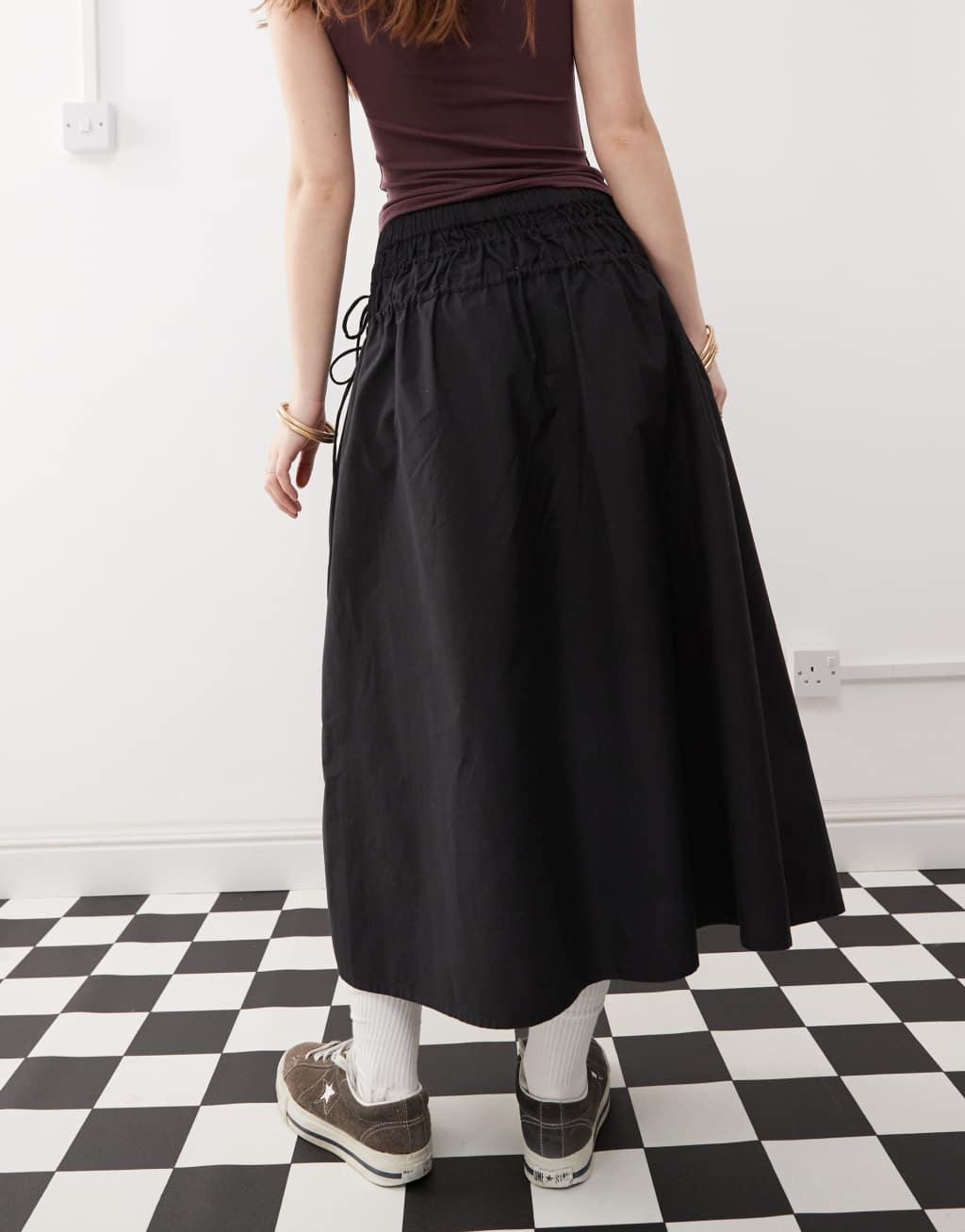 Reclaimed Vintage full poplin midi skirt with tie sides in black Product Image