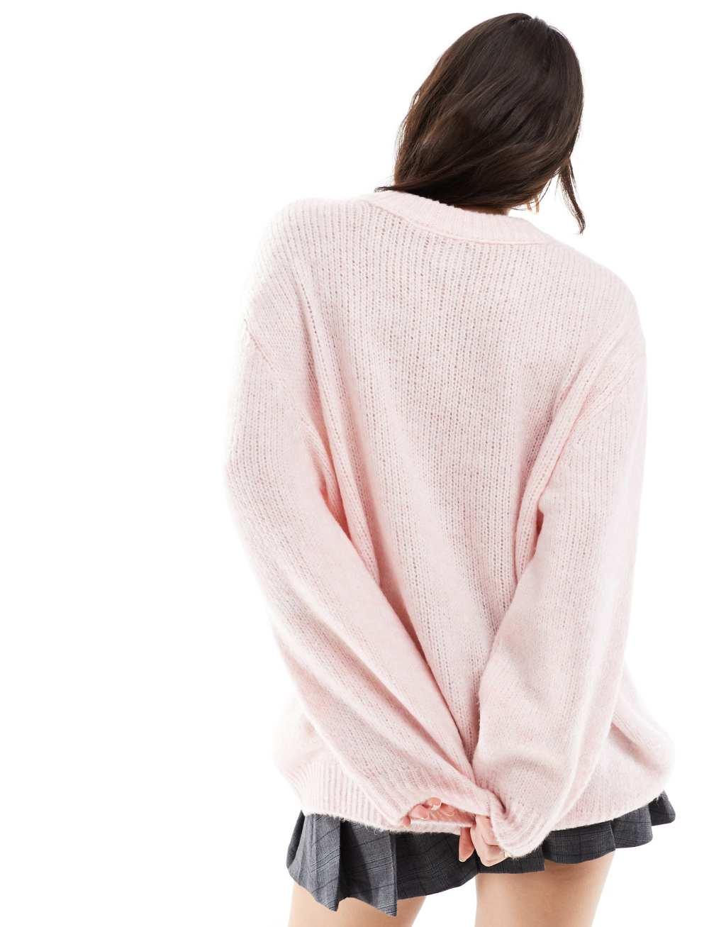 ASOS DESIGN oversized crew neck sweater in pink Product Image