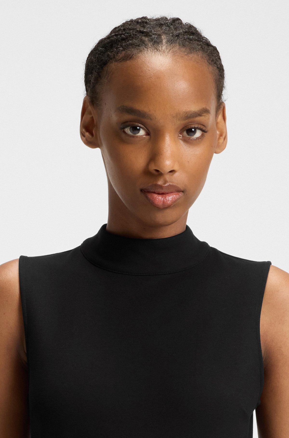 Sleeveless knitted dress with pleated skirt Product Image