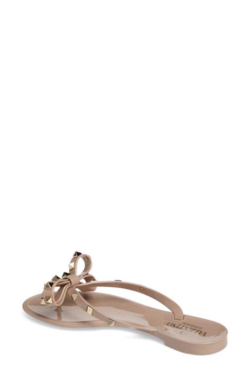 VALENTINO GARAVANI Women Rockstud Rubber Flip Flops In Beige Product Image