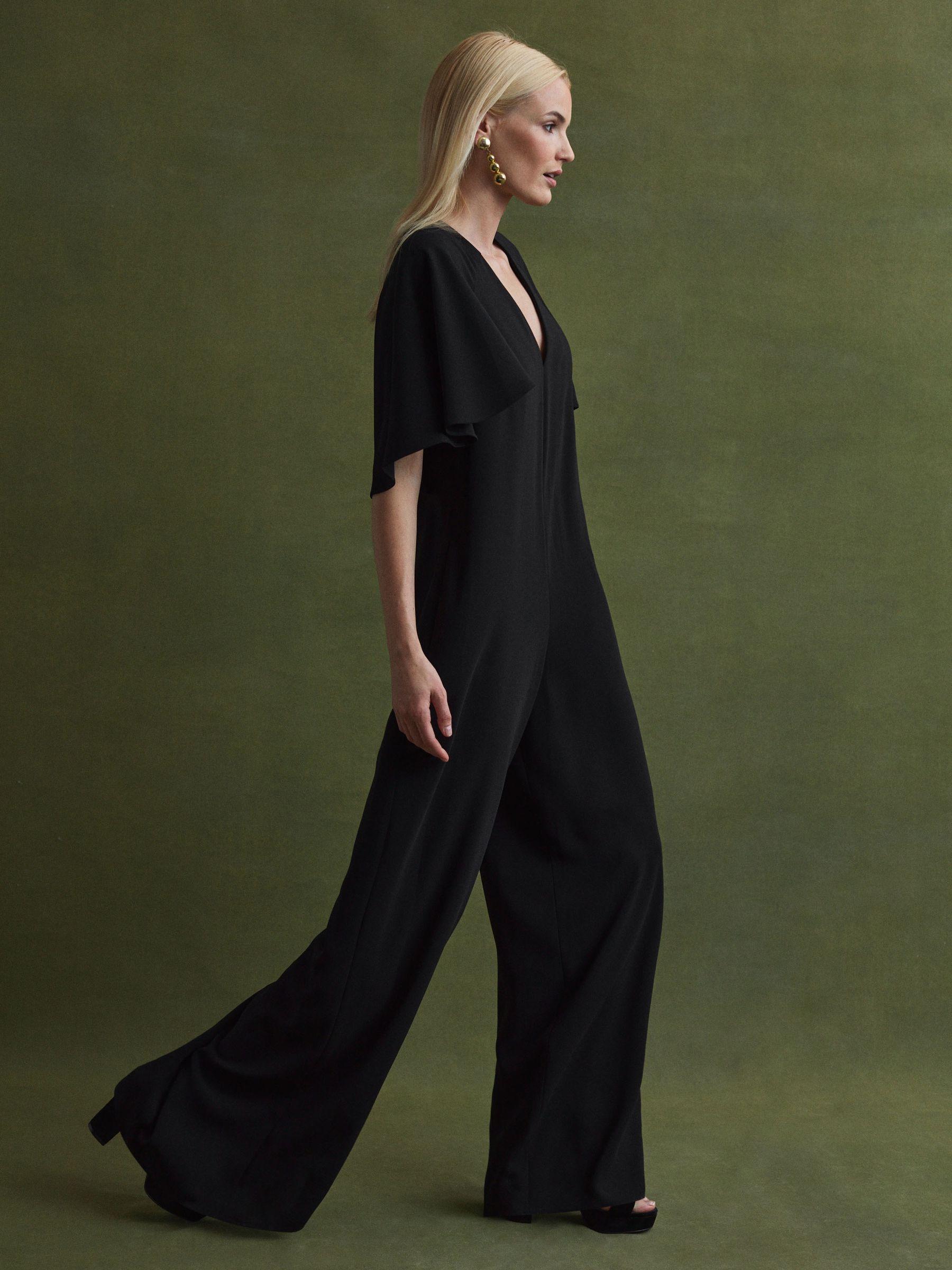 Florere Relaxed Fit Cape Sleeve Jumpsuit in Black Product Image