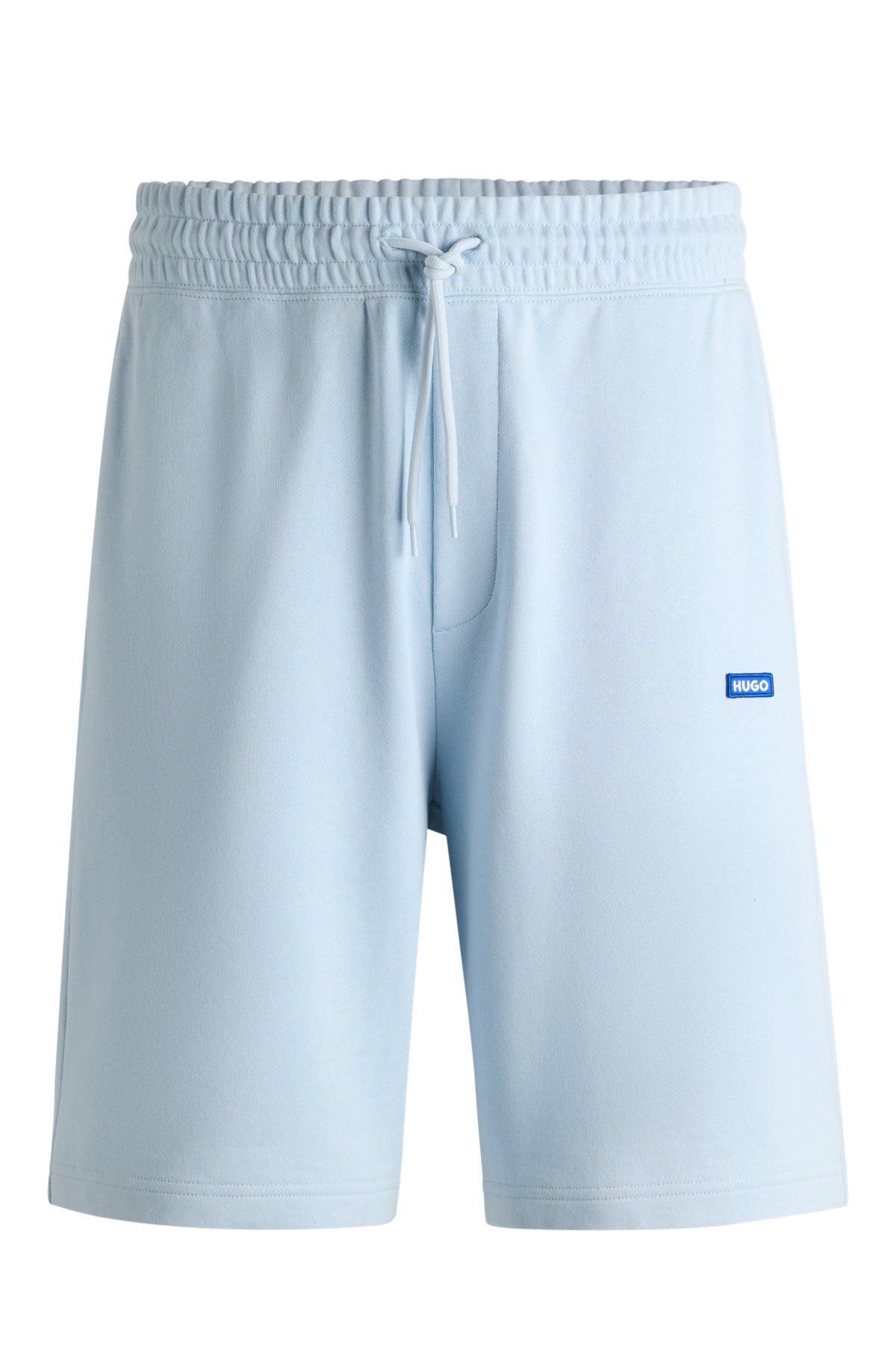 Cotton-terry shorts with blue logo patch Product Image